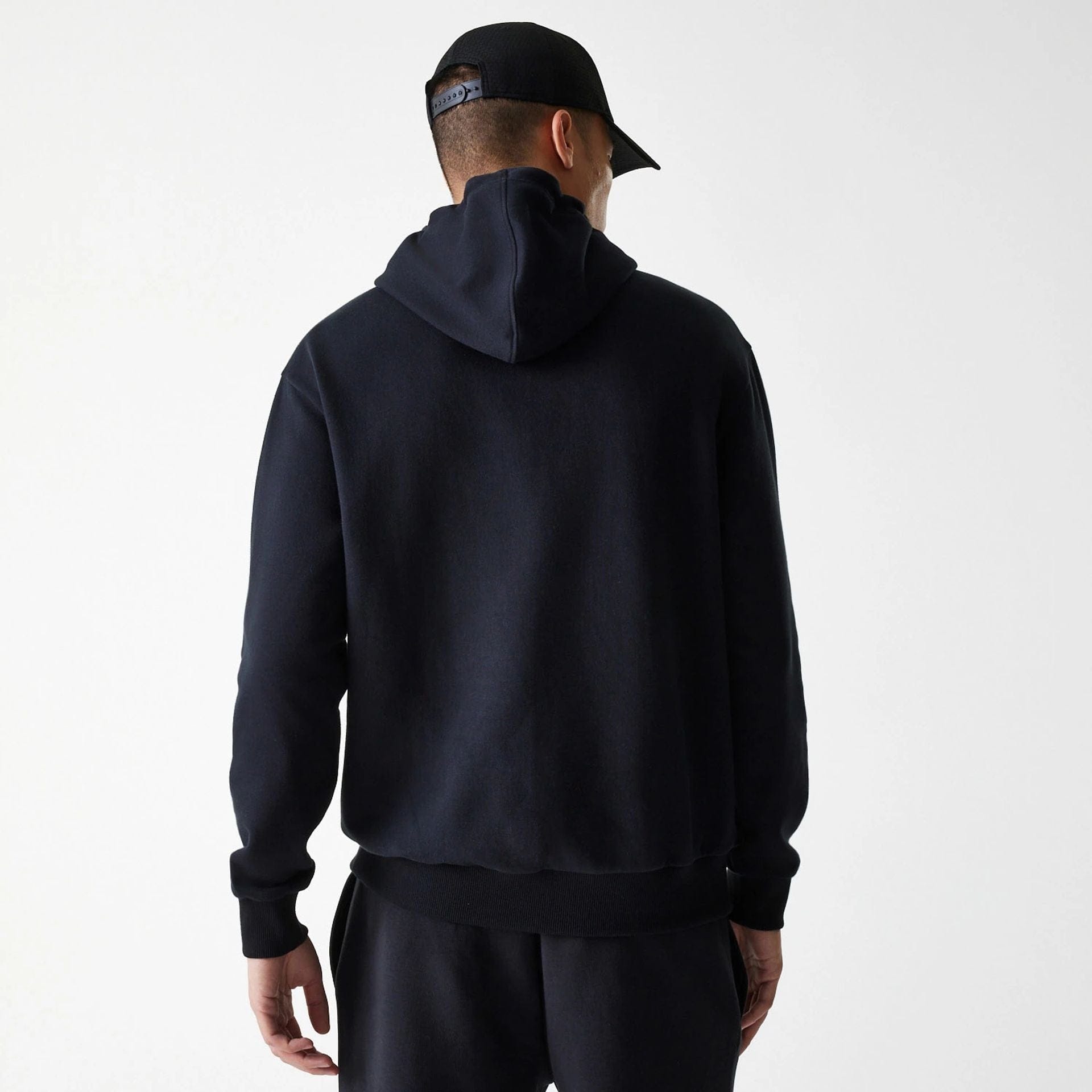 The Male model is wearing New York Yankees MLB League Essential Black Oversized Pullover Hoodie 2