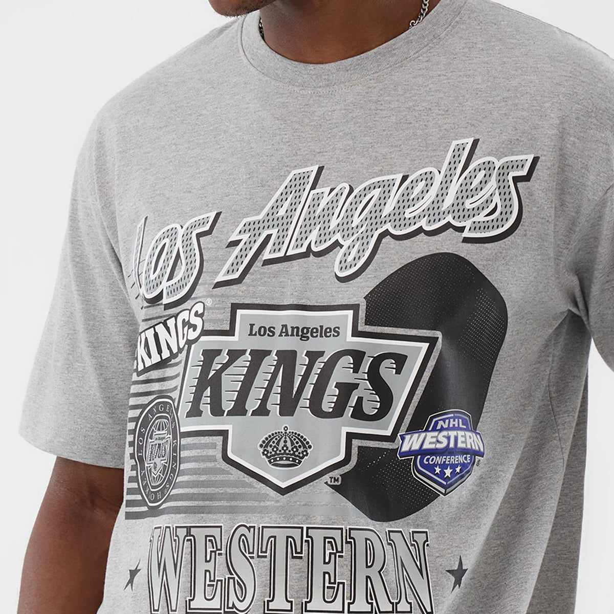 New Era LA Kings NHL Sport Classic Grey T-Shirt, front view featuring bold black and white Los Angeles Kings graphics including 'Los Angeles', 'Kings', and NHL Western Conference logos, printed on a light grey background.