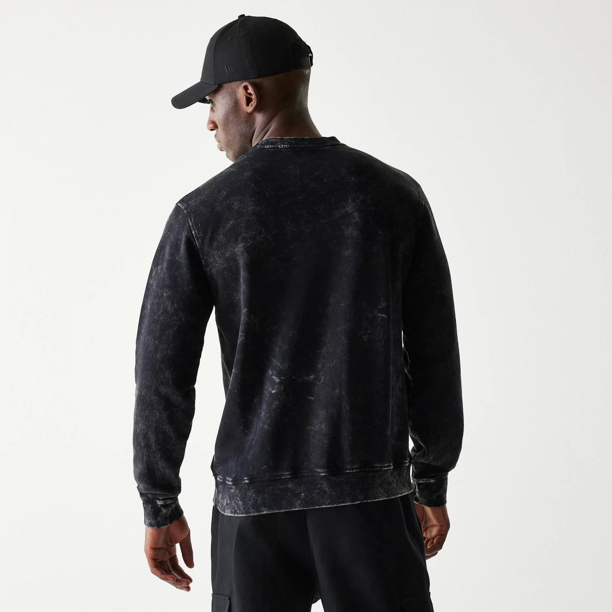 The Male model is wearing Las Vegas Raiders NFL Throwback Black Crew Neck Sweater 2