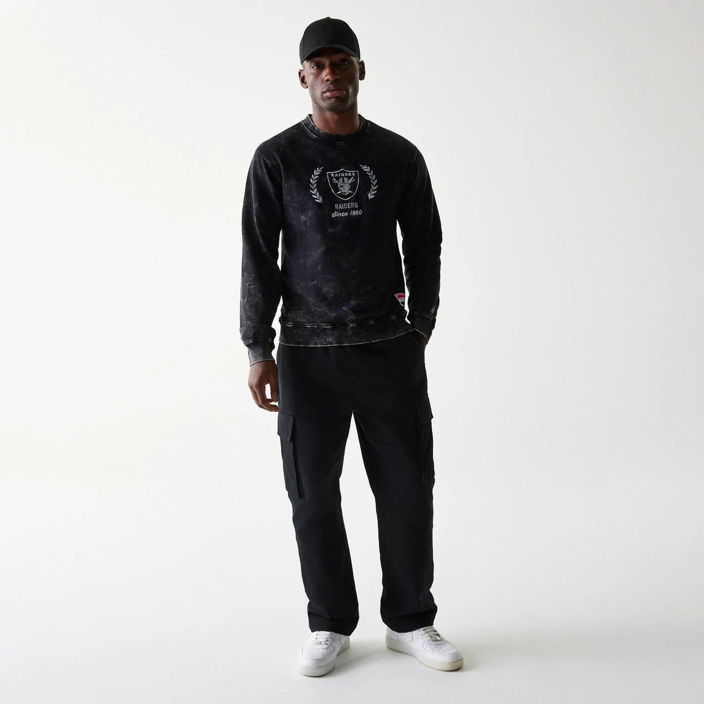 The Male model is wearing Las Vegas Raiders NFL Throwback Black Crew Neck Sweater 6