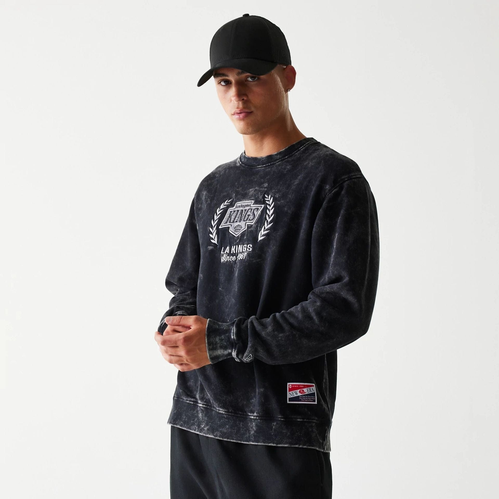 The Male model is wearing LA Kings NHL Throwback Black Crew Neck Sweater 1