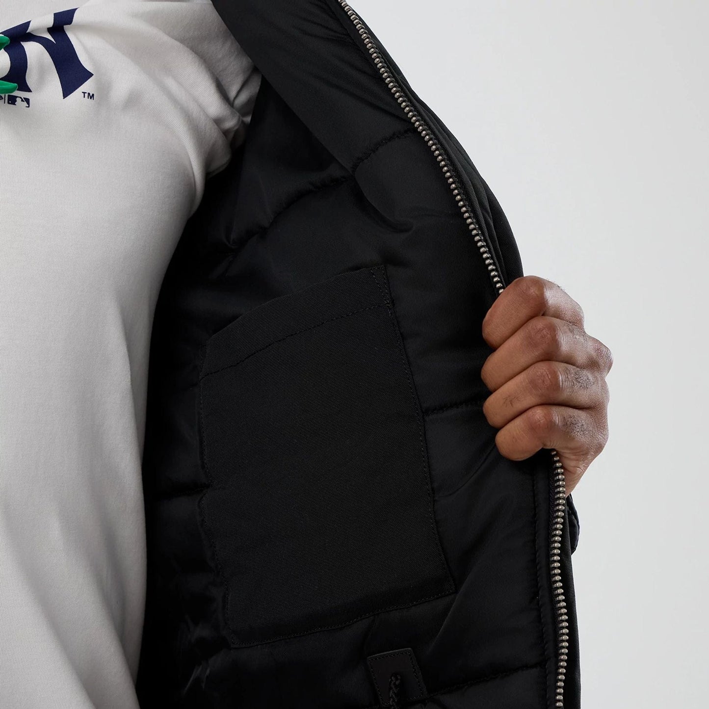 The Male model is wearing New York Yankees MLB X Alpha Black Parka Jacket 7