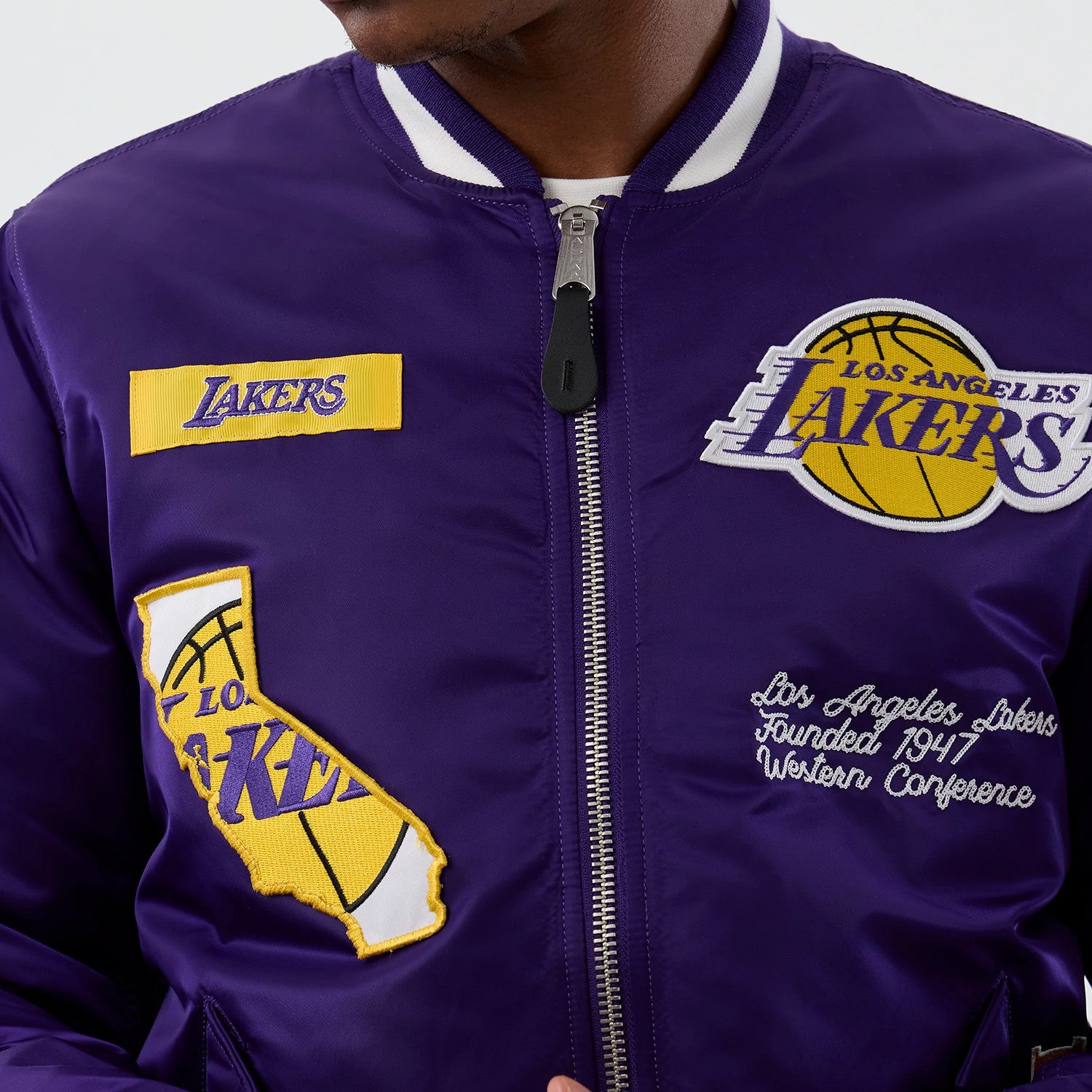 The Male model is wearing LA Lakers NBA x Alpha Purple Jacket 4