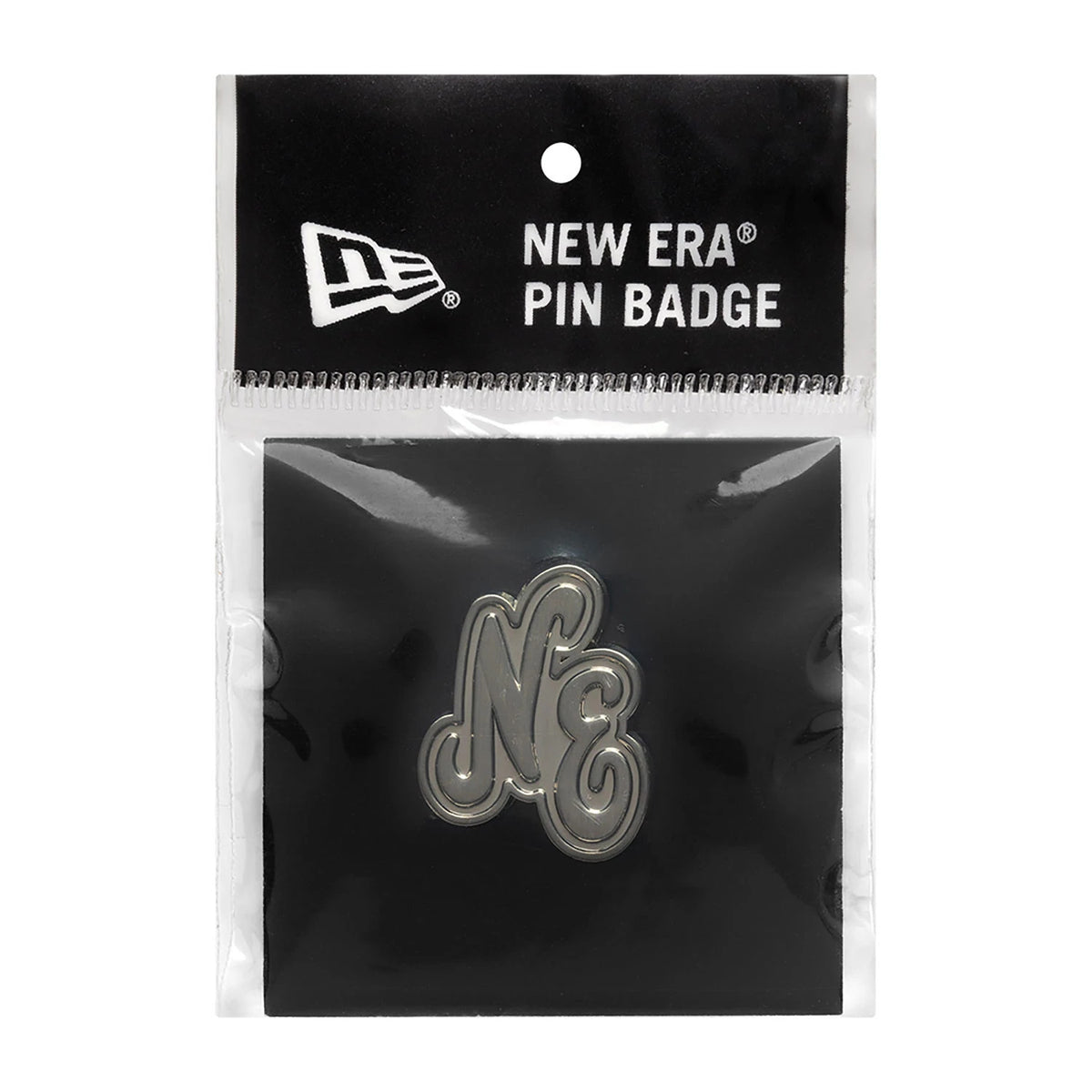 New Era Script Heritage Connect Silver Pin Badge, front view showing the silver debossed NE logo in an ornate script style, set against a black background and packaged in a clear plastic sleeve.