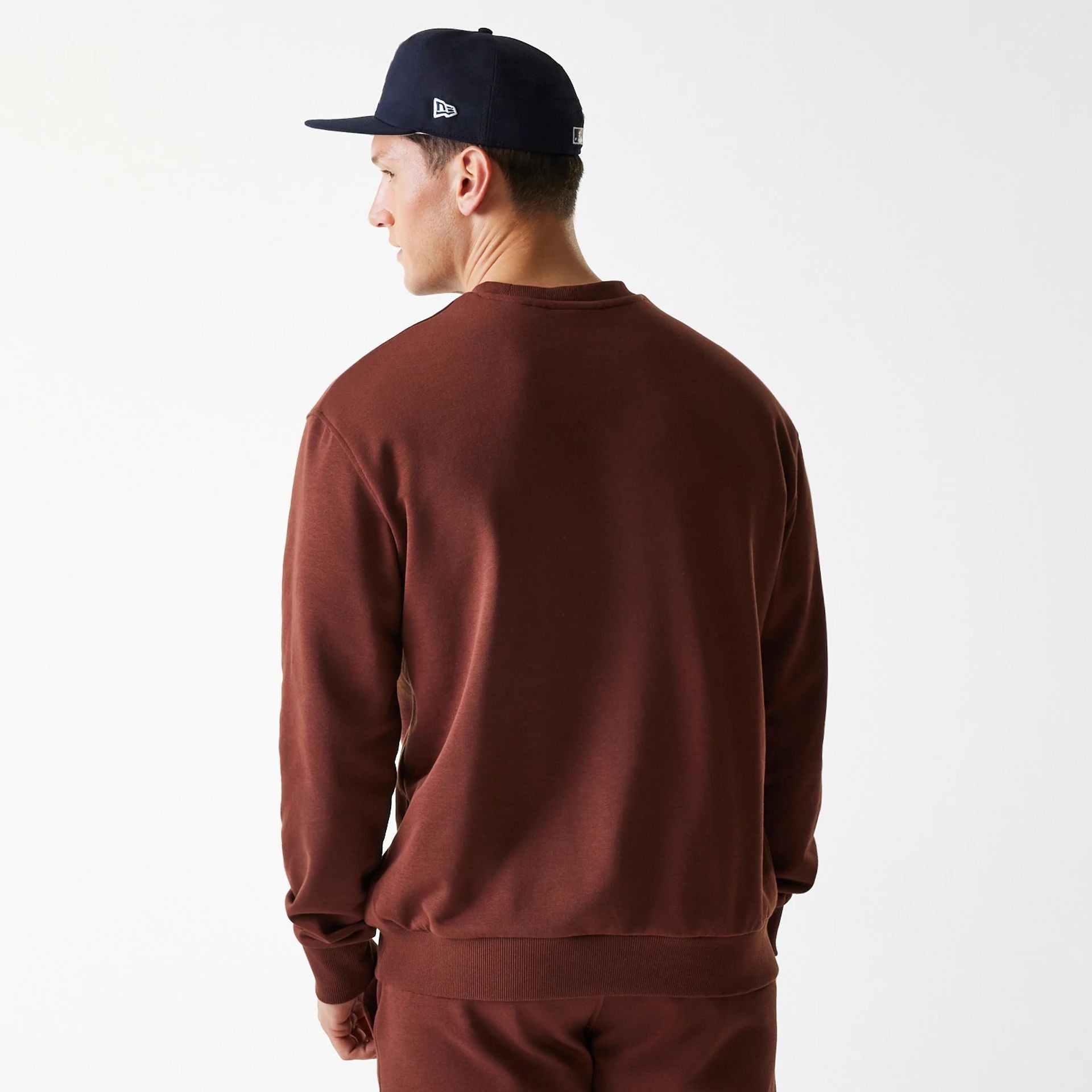 The Male model is wearing New York Yankees MLB Midi League Essential Brown Oversized Crew Neck Sweater 2