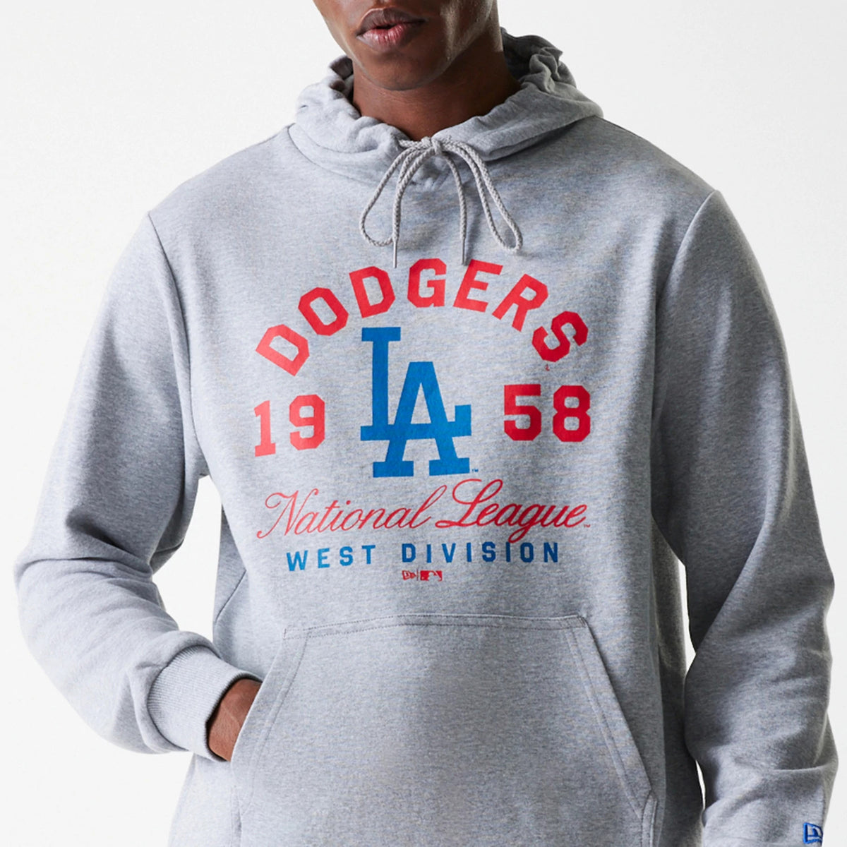 New Era LA Dodgers MLB Wordmark Grey Pullover Hoodie, front view showing a centred blue LA logo with red and blue text above and below, a drawstring hood, kangaroo pocket, and a small embroidered New Era logo on the cuff.