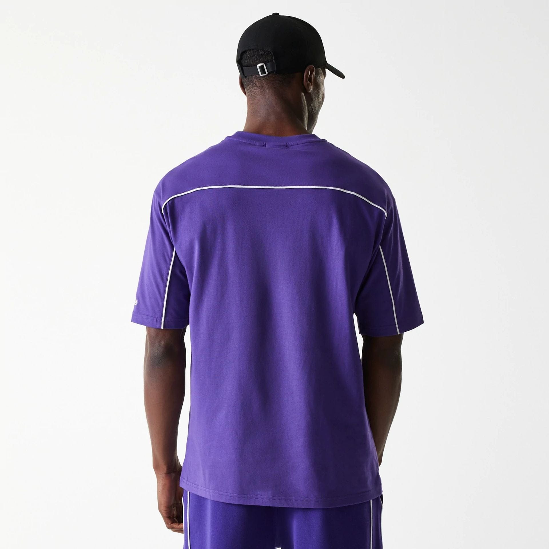 The Male model is wearing LA Lakers NBA Piping Purple Oversized T-Shirt 2