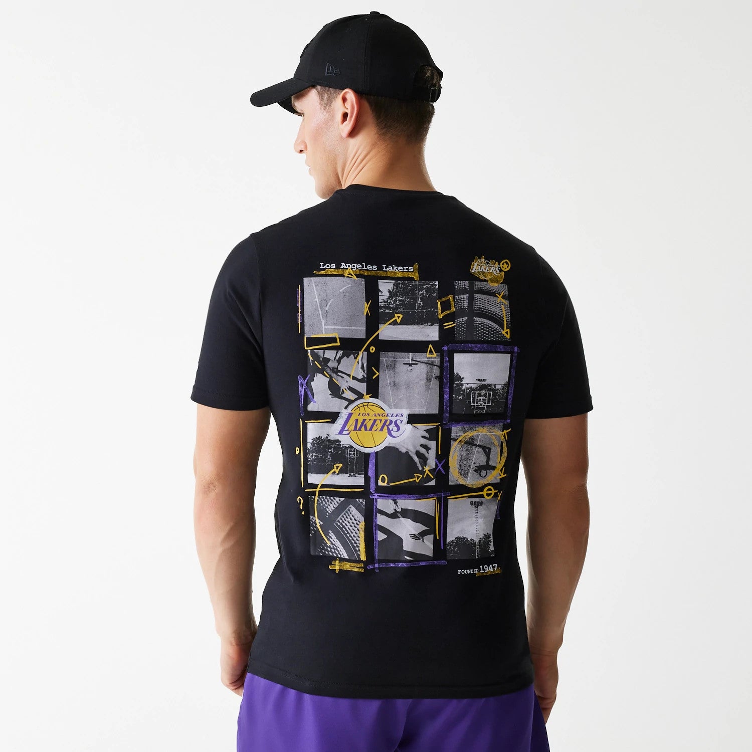 The Male model is wearing LA Lakers NBA Photographic Print Black T-Shirt 2