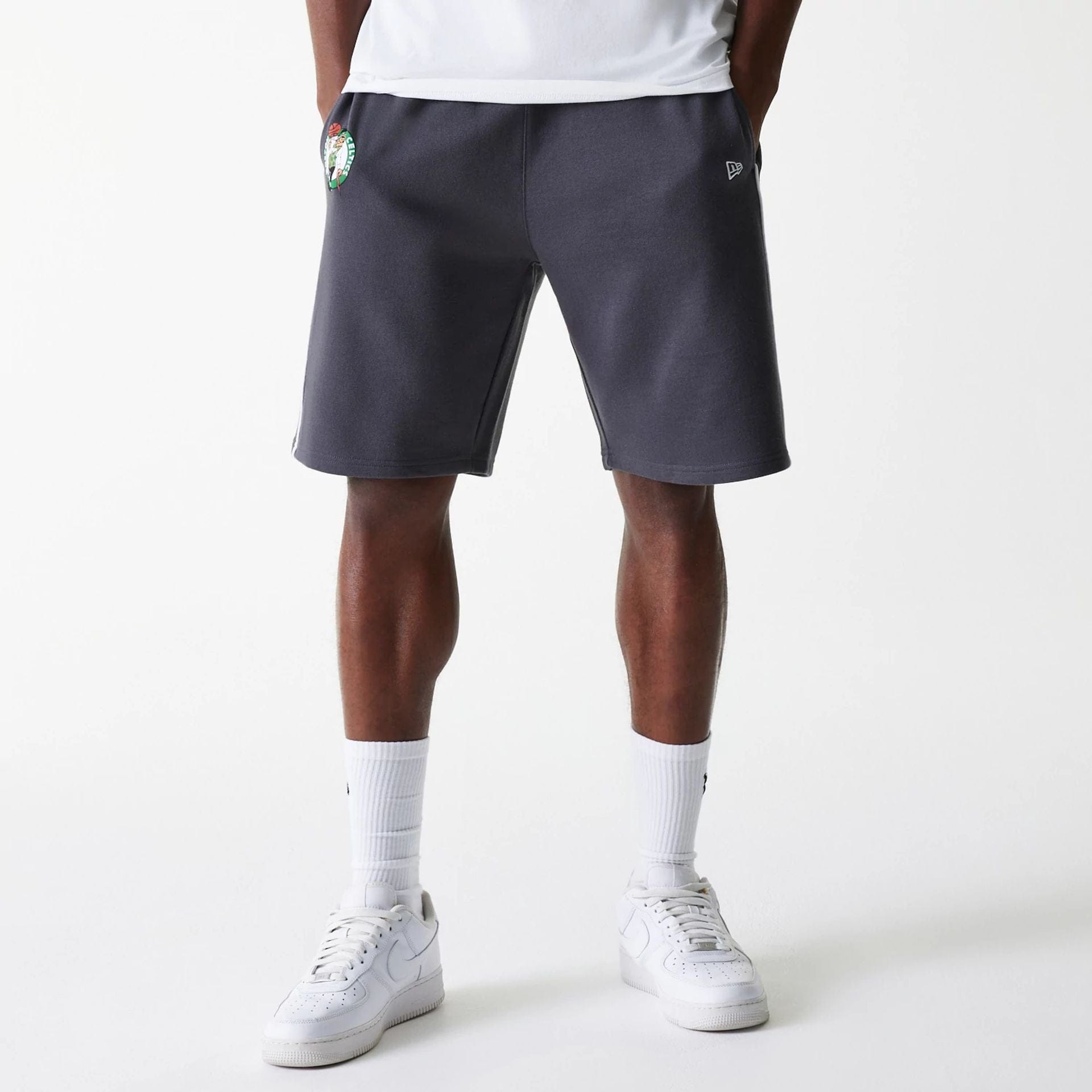 The Male model is wearing Boston Celtics NBA Piping Dark Grey Shorts 1