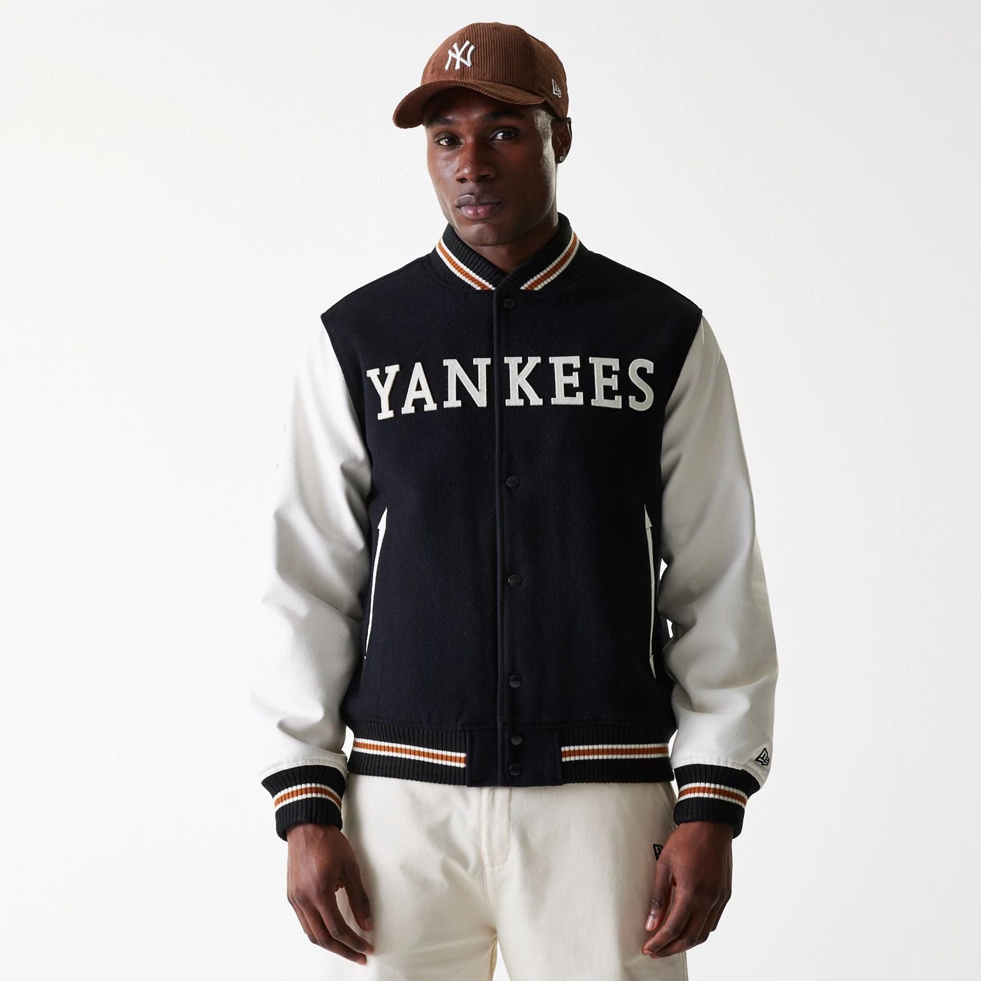 The Male model is wearing New York Yankees MLB Wordmark Black Varsity Jacket 1
