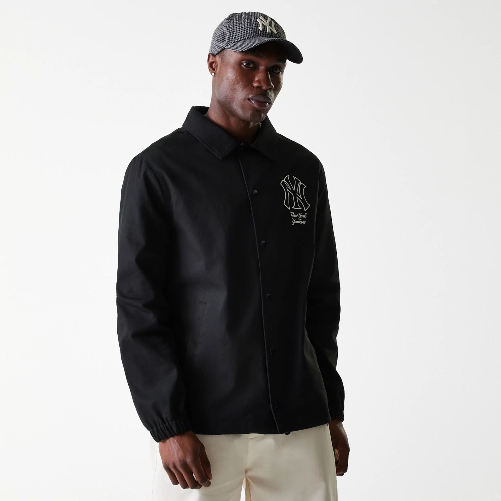 The Male model is wearing New York Yankees MLB Twill Black Coaches Jacket 1