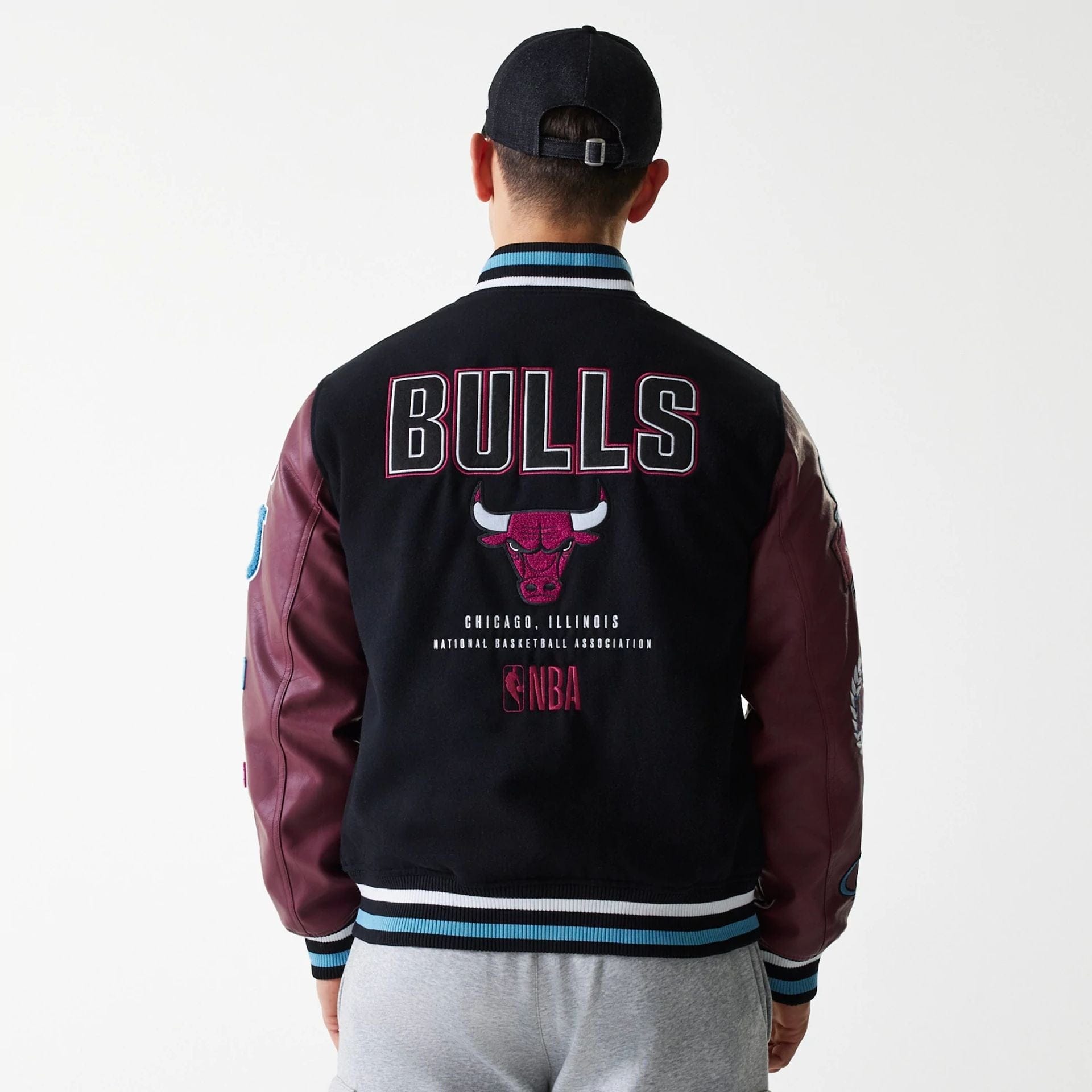 The Male model is wearing Chicago Bulls NBA Patch Black Varsity Jacket 2