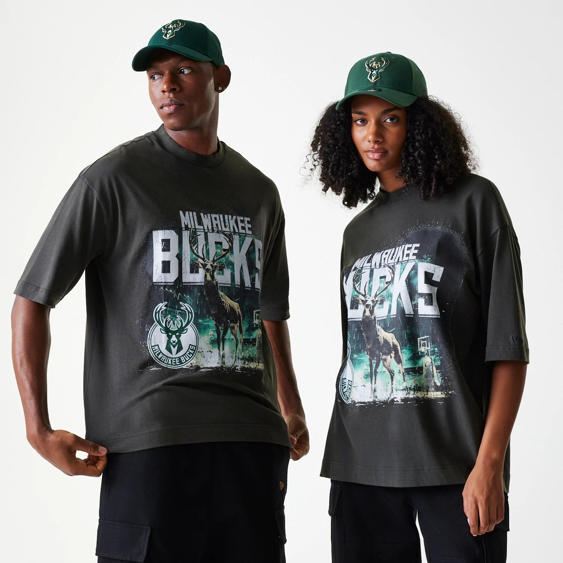 The Male model is wearing Milwaukee Bucks NBA Washed Graphic Grey T-Shirt 1