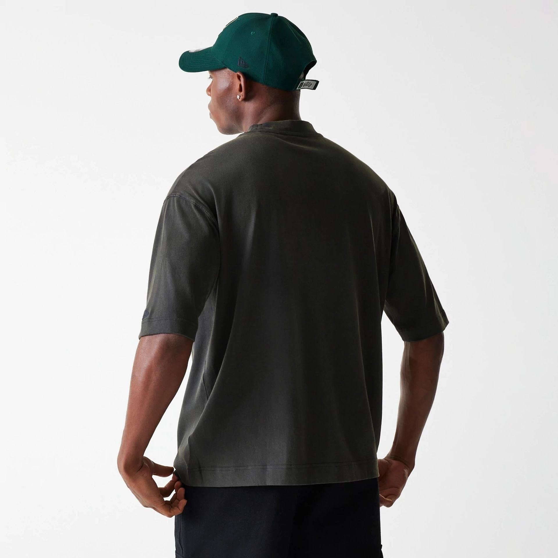 The Male model is wearing Milwaukee Bucks NBA Washed Graphic Grey T-Shirt 2
