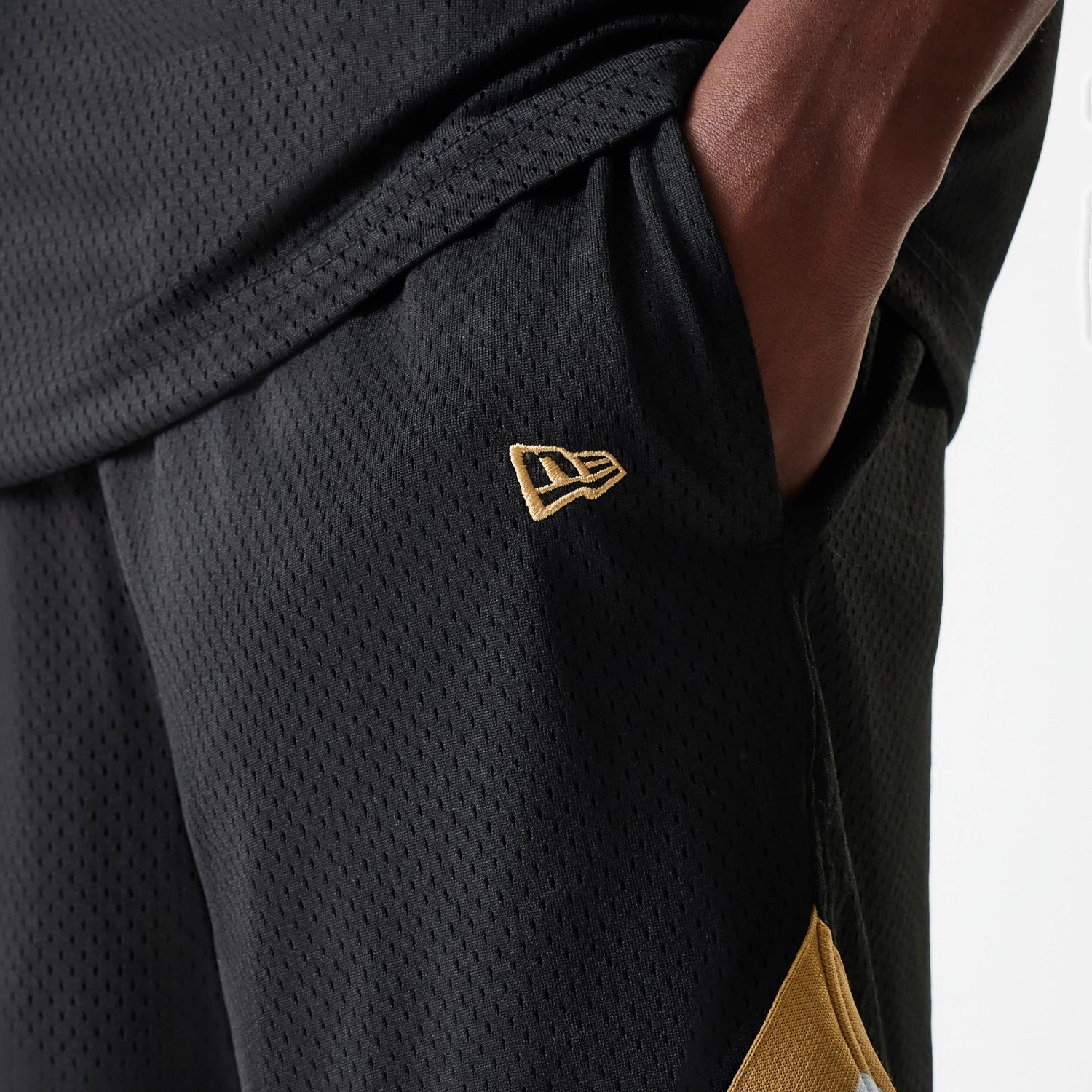 The Male model is wearing San Francisco 49ers NFL Mesh Black Shorts 4