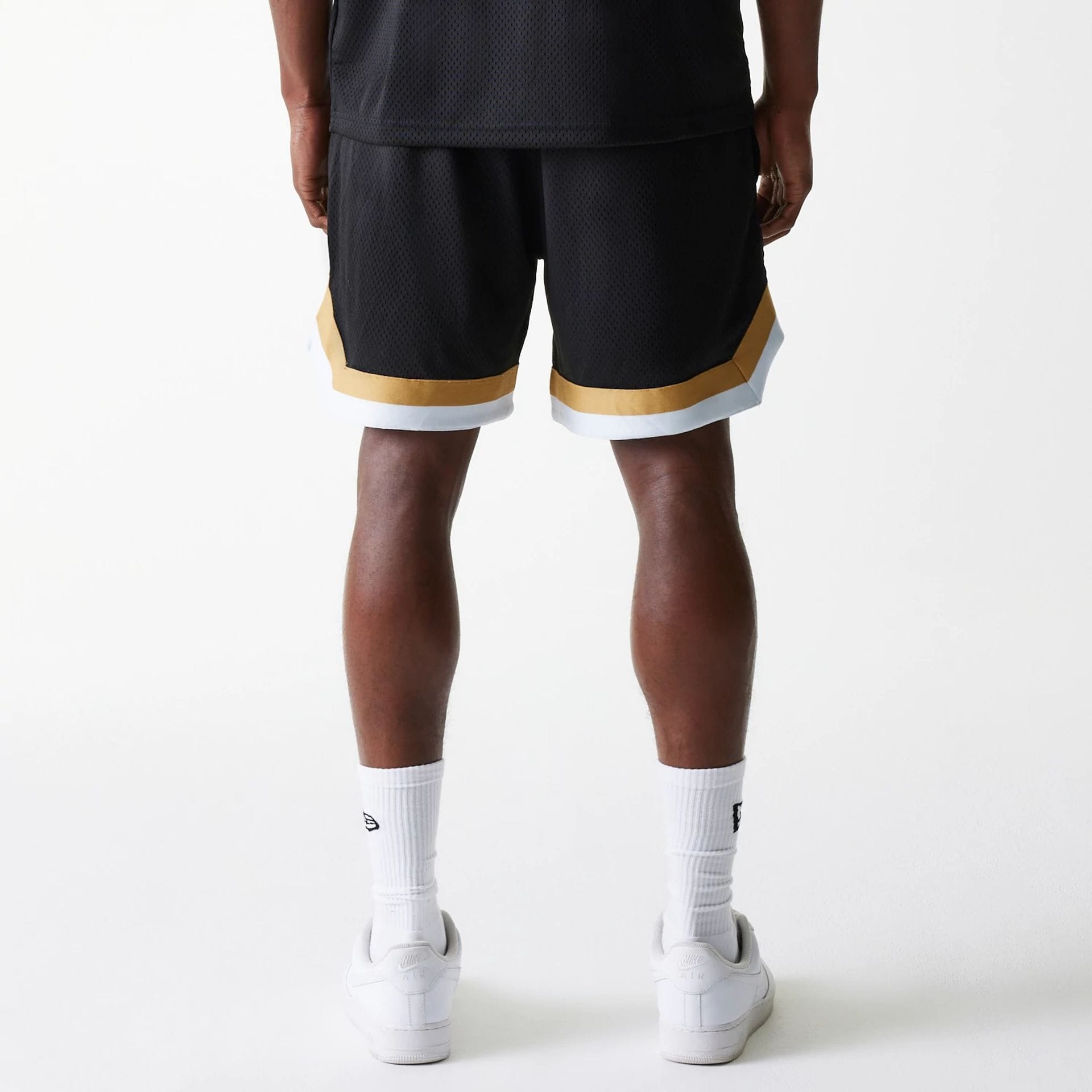 The Male model is wearing San Francisco 49ers NFL Mesh Black Shorts 2