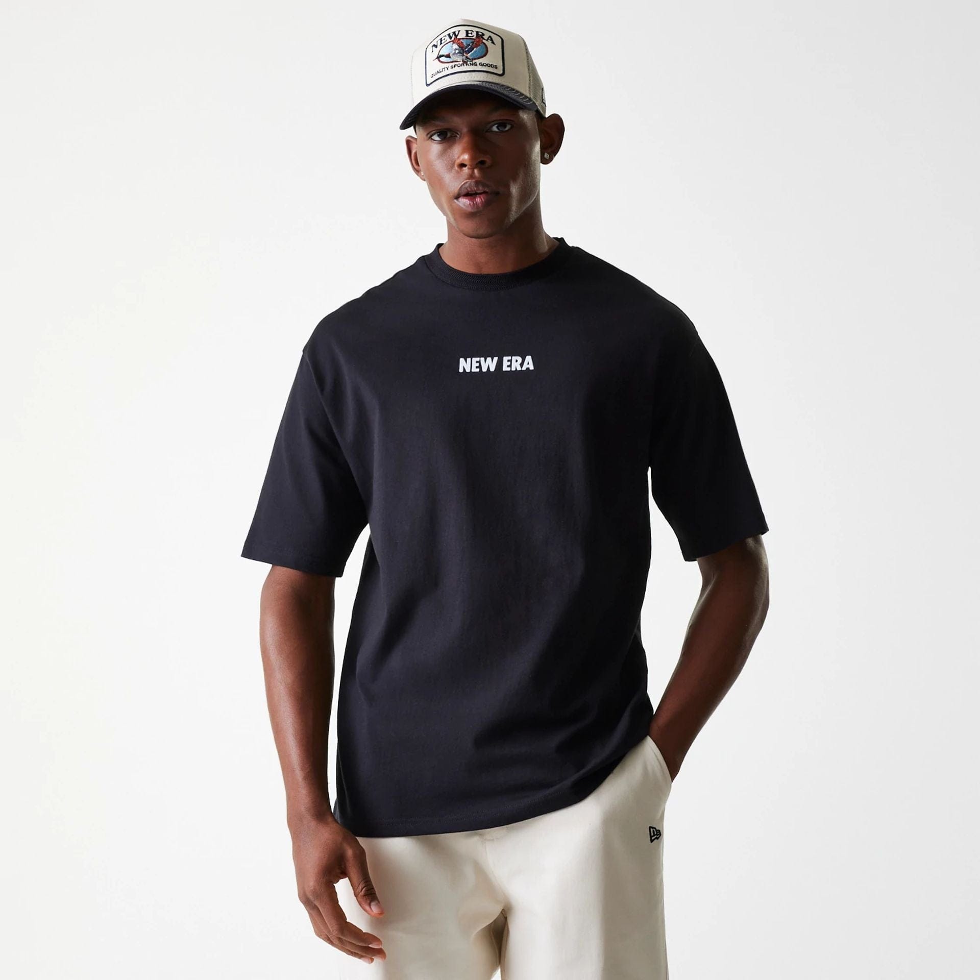 The Male model is wearing New Era Graphic Black Oversized T-Shirt 1
