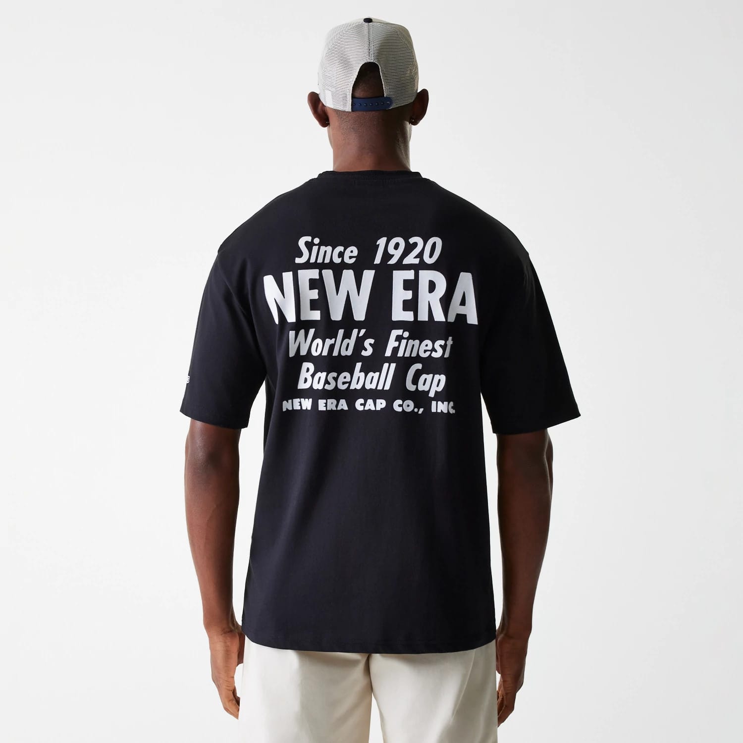 The Male model is wearing New Era Graphic Black Oversized T-Shirt 2
