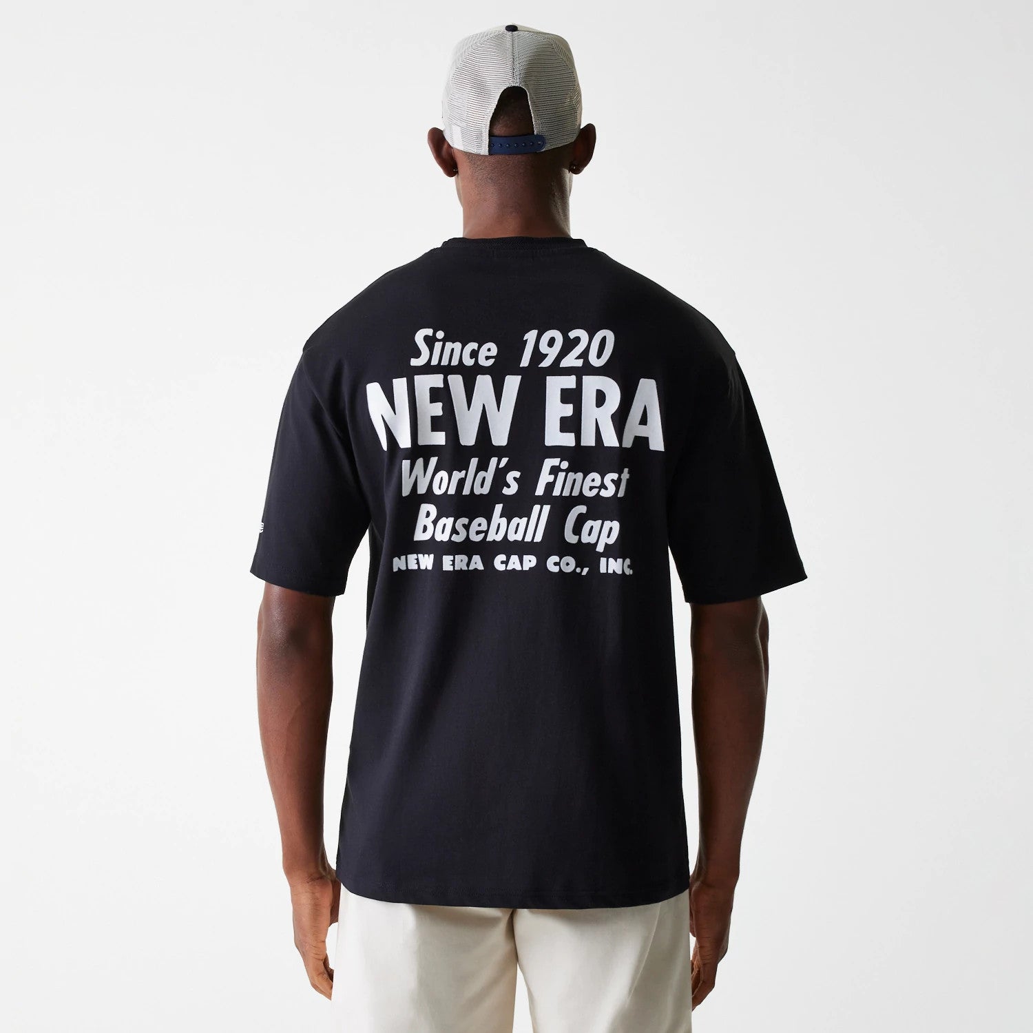 The Male model is wearing New Era Graphic Black Oversized T-Shirt 2
