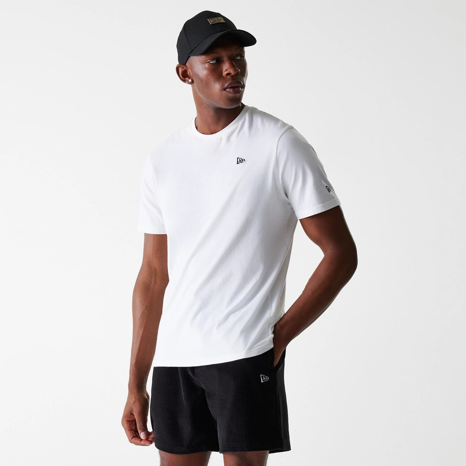 The Male model is wearing New Era Cord Black Shorts 4