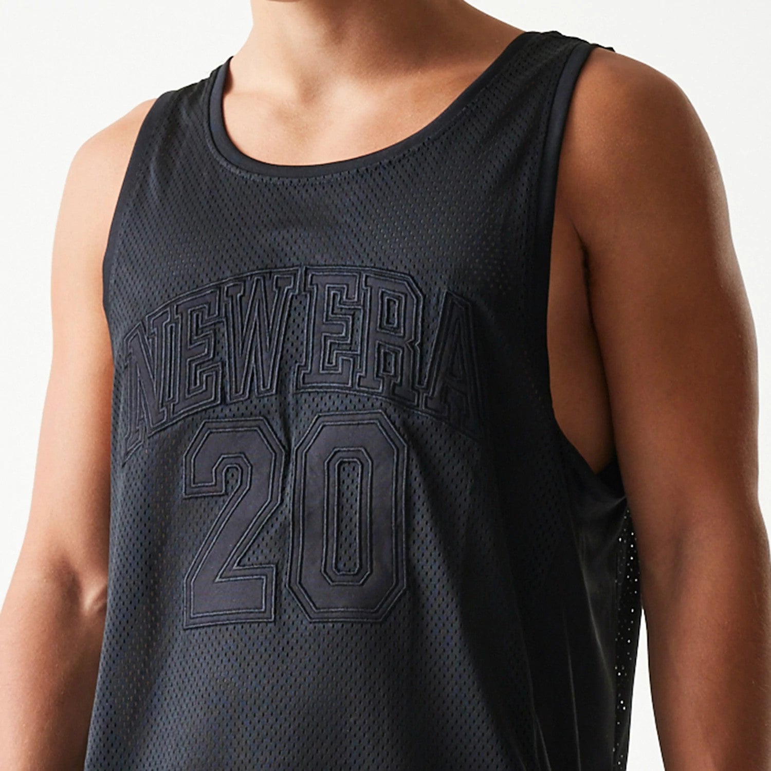 The Male model is wearing New Era Mesh Black Mesh Vest 4
