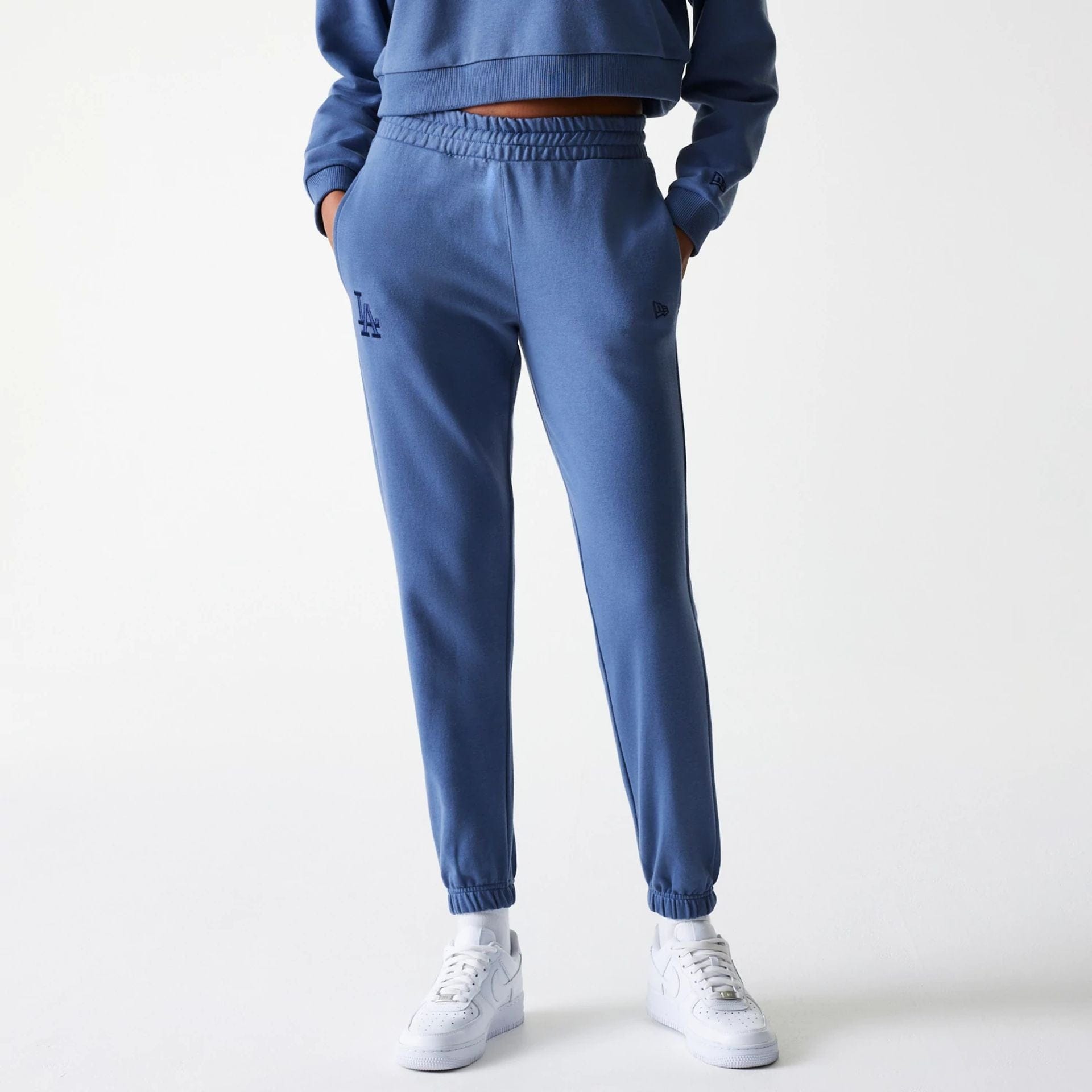 The Female model is wearing LA Dodgers Womens MLB Midi League Essential Dark Blue Joggers 1
