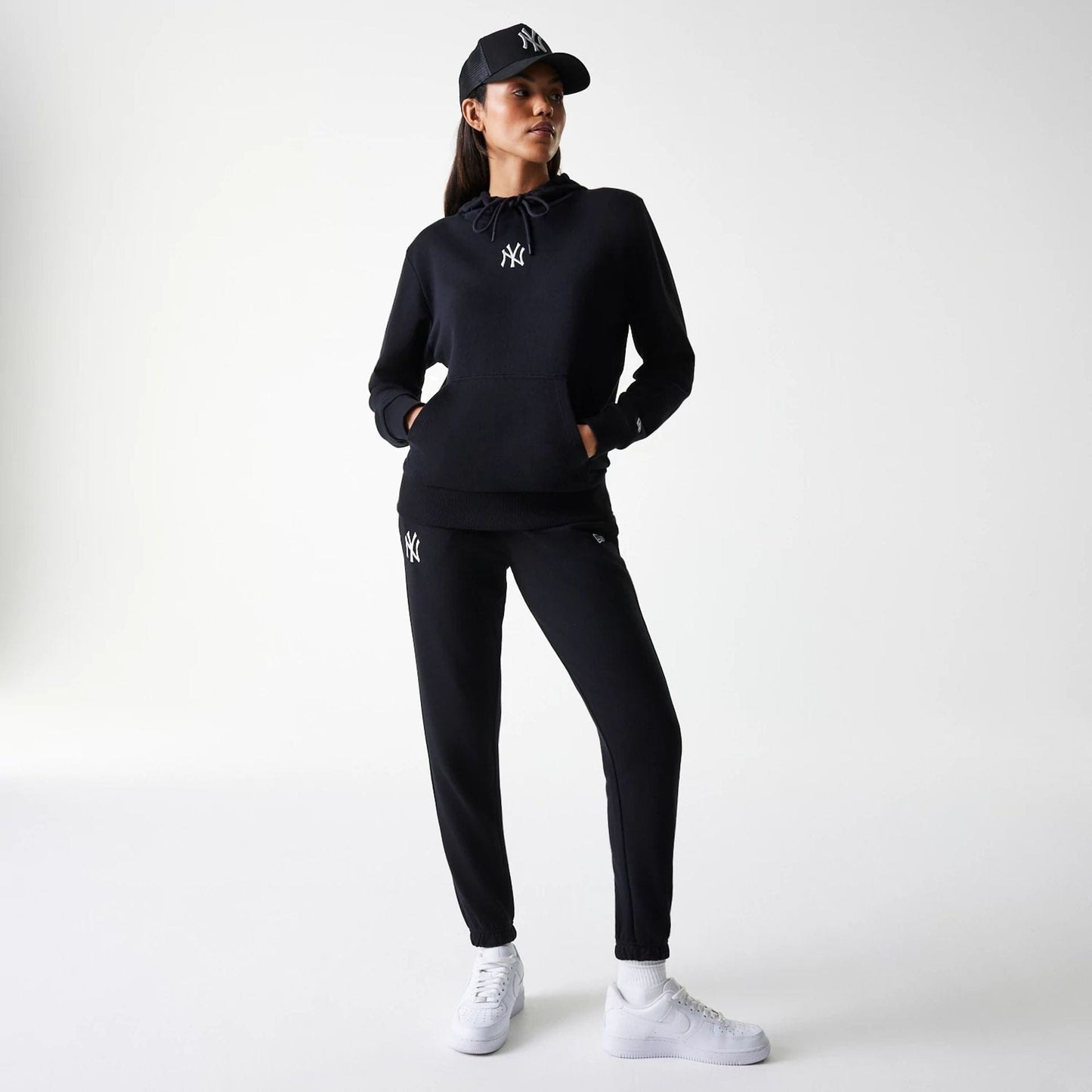 The Female model is wearing New York Yankees Womens MLB Midi League Essential Black Joggers 8