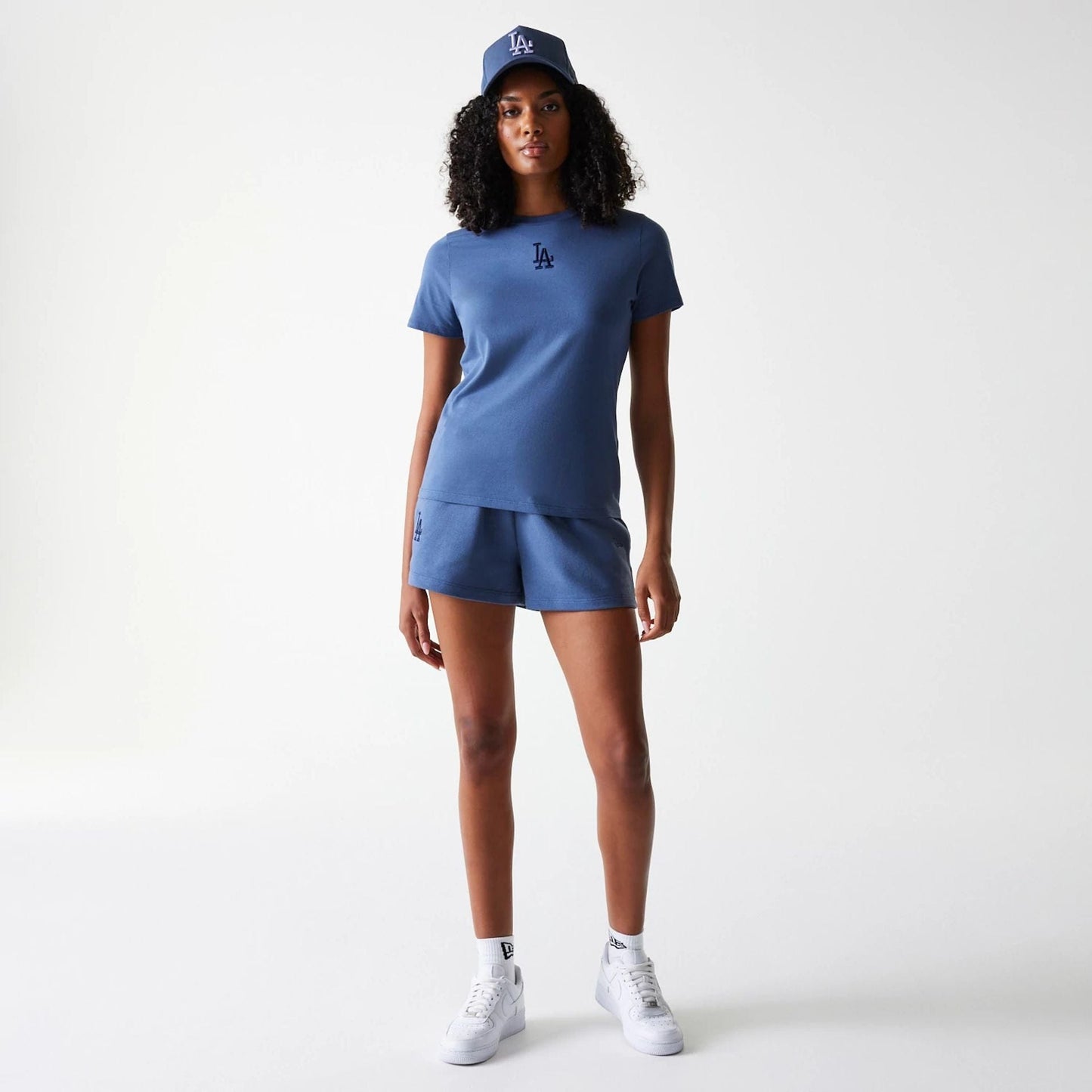 The Female model is wearing LA Dodgers Womens MLB Midi League Essential Dark Blue Shorts 7