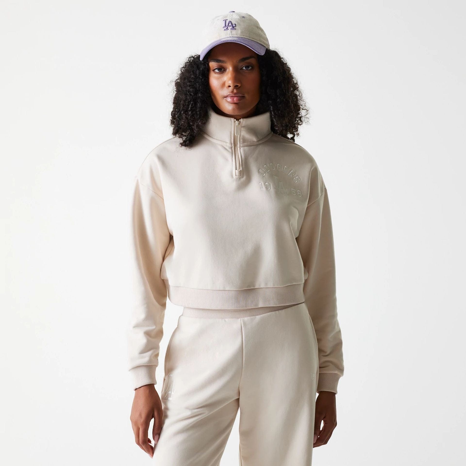 The Female model is wearing LA Dodgers Womens MLB Tonal Light Beige Cropped 1/4 Zip Sweater 1