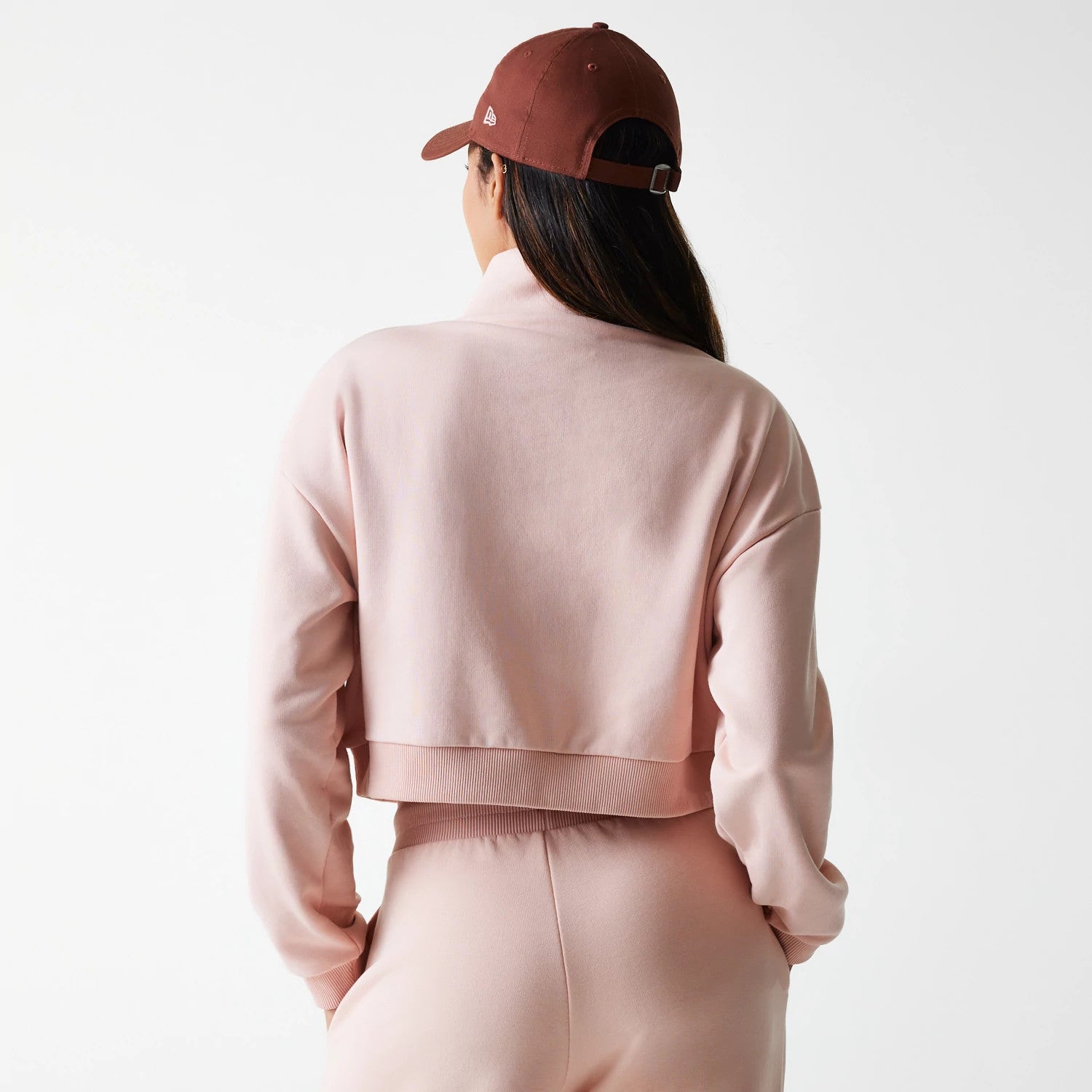 The Female model is wearing New York Yankees Womens MLB Tonal Pastel Pink Cropped 1/4 Zip Sweater 2