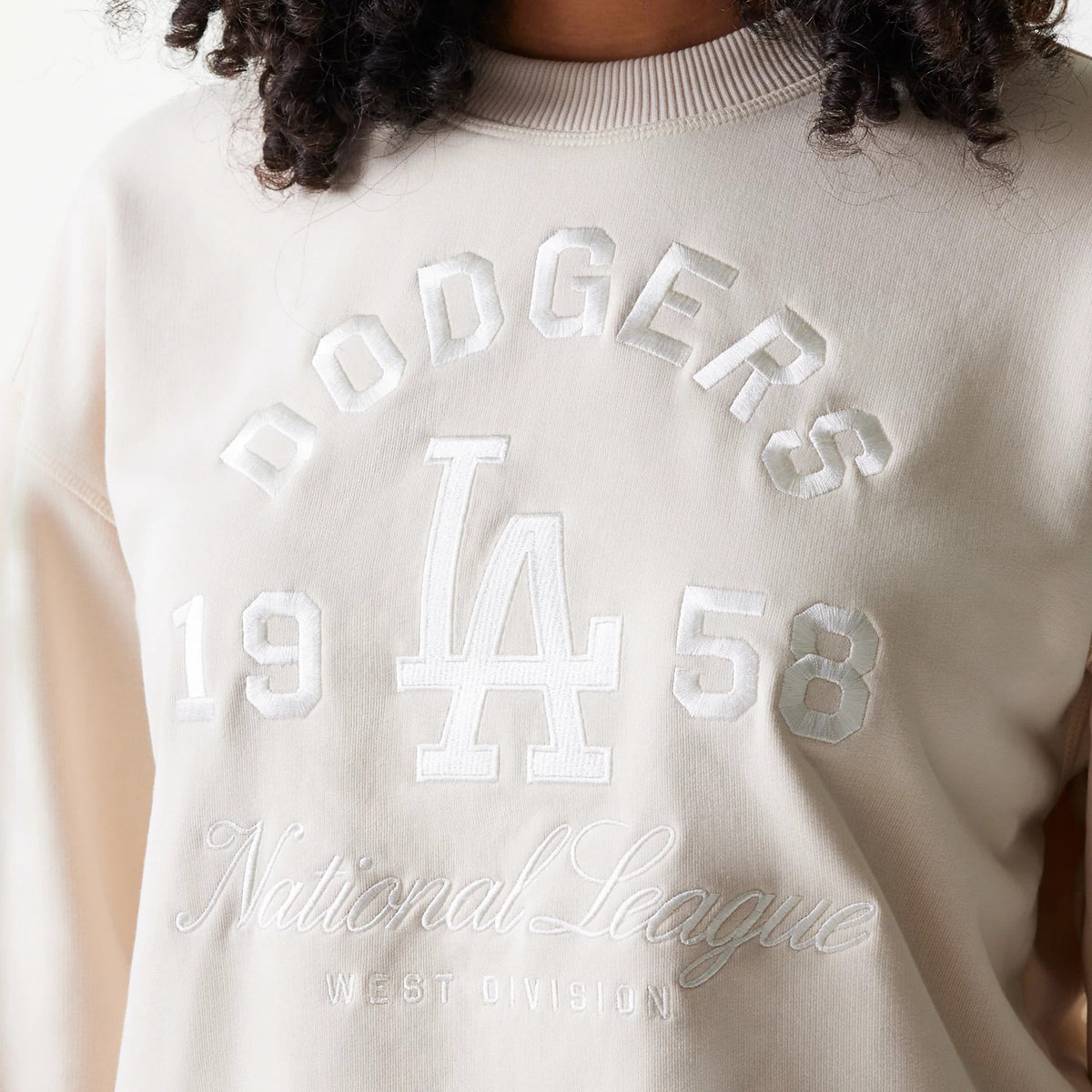 New Era LA Dodgers Womens MLB Tonal Graphic Light Beige Oversized Crew Neck Sweater, front view with raised embroidery featuring Dodgers lettering, the LA logo, and 1958 above National League West Division text.