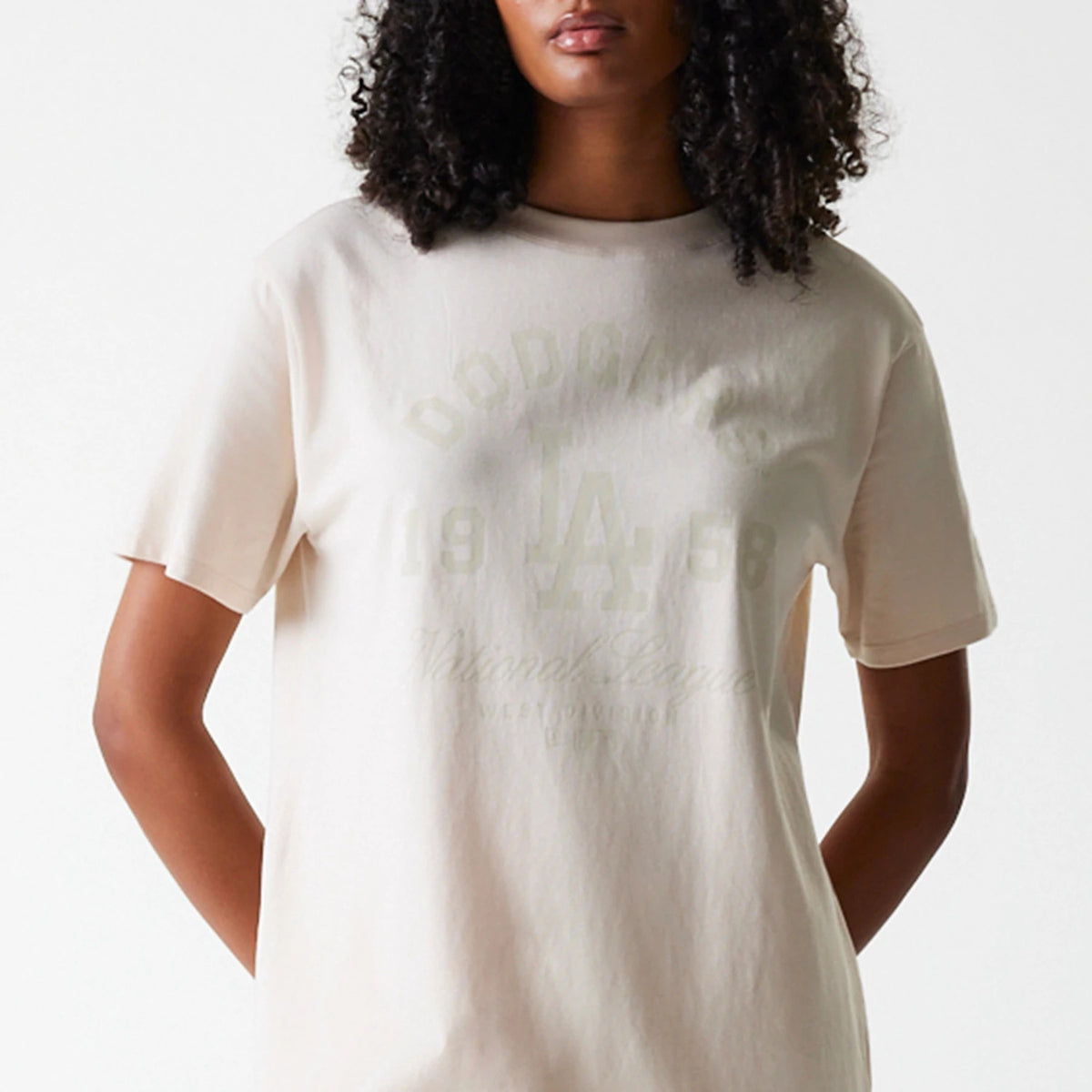 New Era LA Dodgers Womens MLB Tonal Graphic Light Beige Oversized T-Shirt, front view featuring a tonal LA Dodgers logo and graphic print across the chest on a light beige oversized tee.