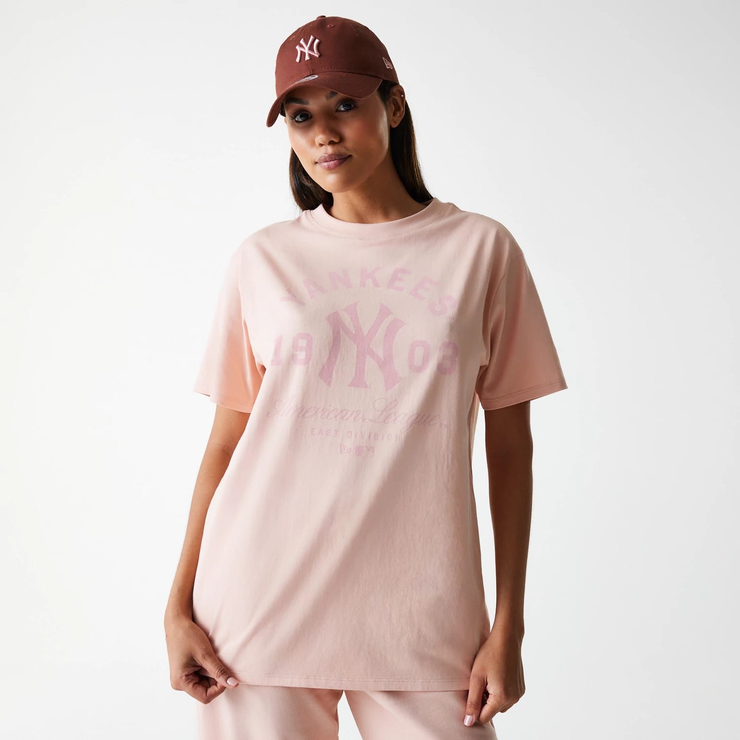 The Female model is wearing New York Yankees Womens MLB Tonal Graphic Pastel Pink Oversized T-Shirt 1