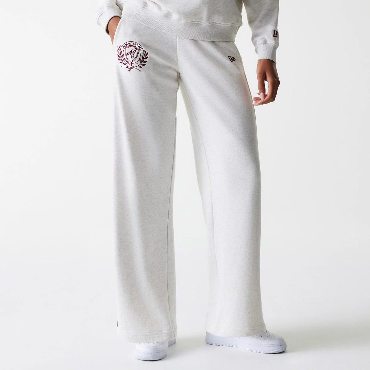 The Female model is wearing Womens New Era Pastel Grey Straight Leg Joggers 1