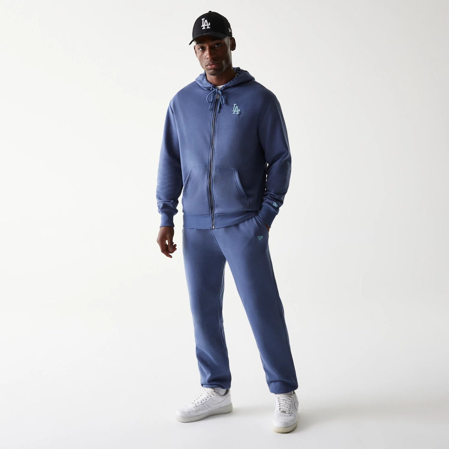 The Male model is wearing LA Dodgers MLB Midi League Essential Dark Blue Joggers 8