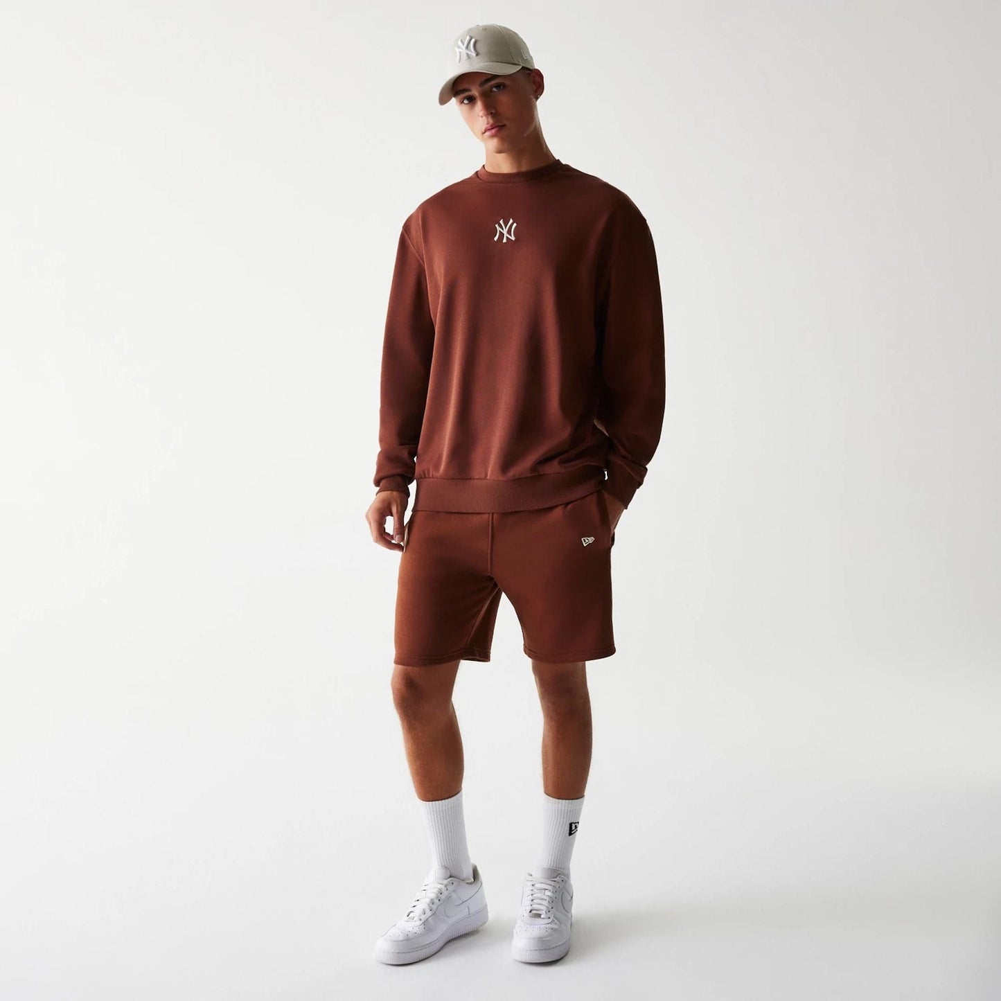 The Male model is wearing New York Yankees MLB Midi League Essential Brown Oversized Crew Neck Sweater 8
