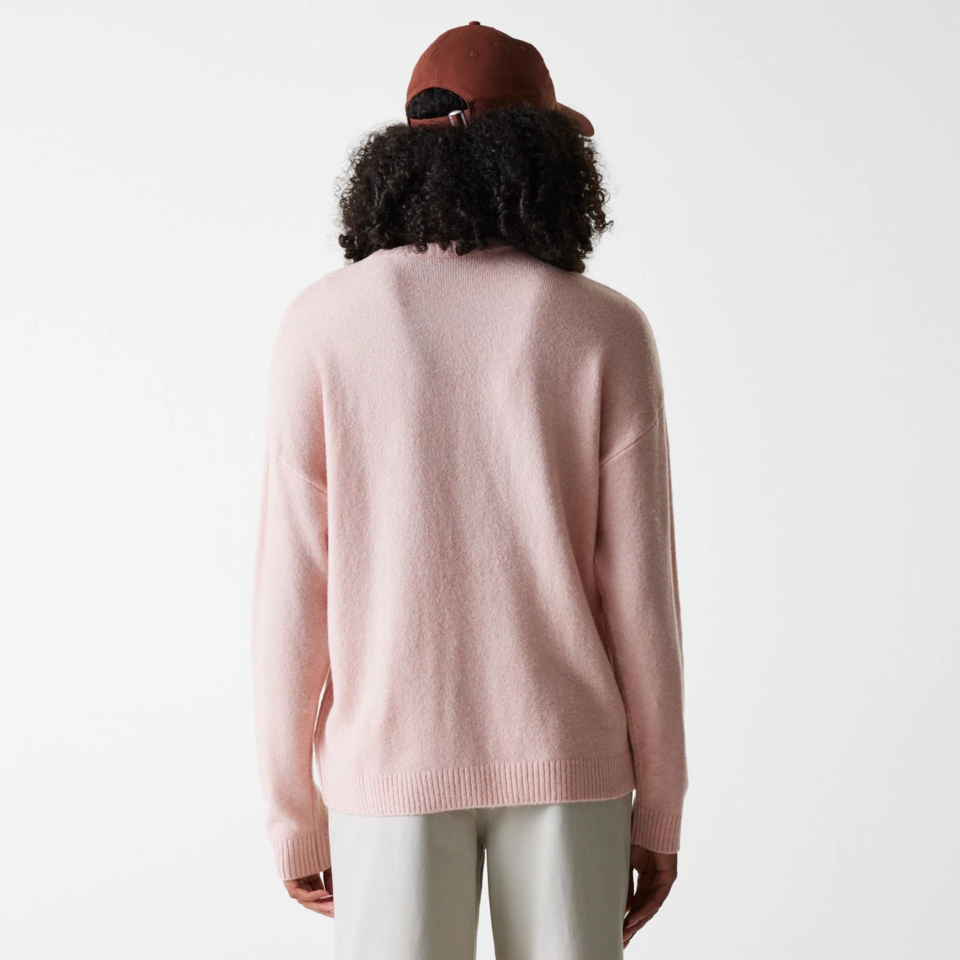 The Female model is wearing New York Yankees Womens MLB Knit Pastel Pink Crew Neck Sweater 2
