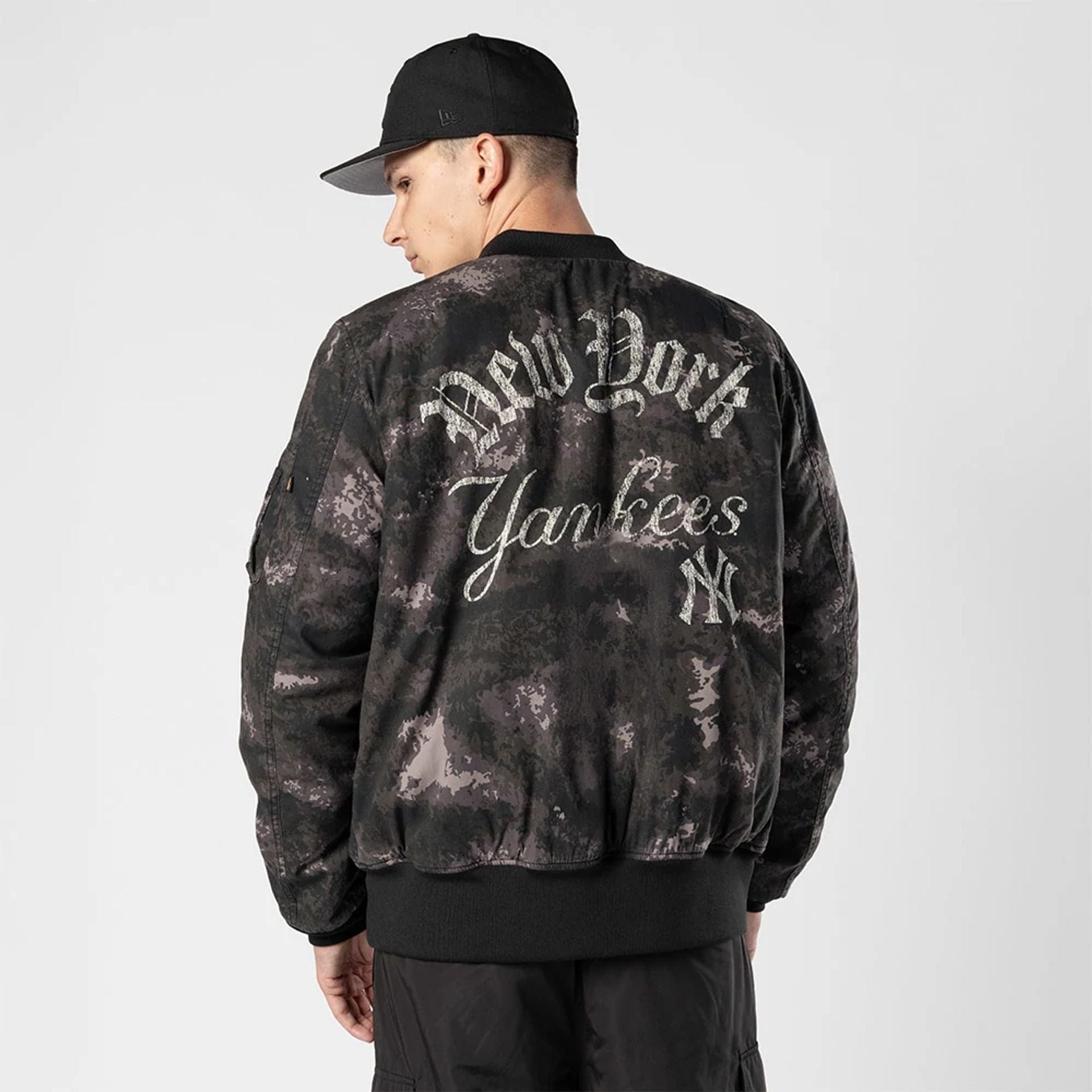 The Male model is wearing New York Yankees MLB X Alpha Black Bomber Jacket 2