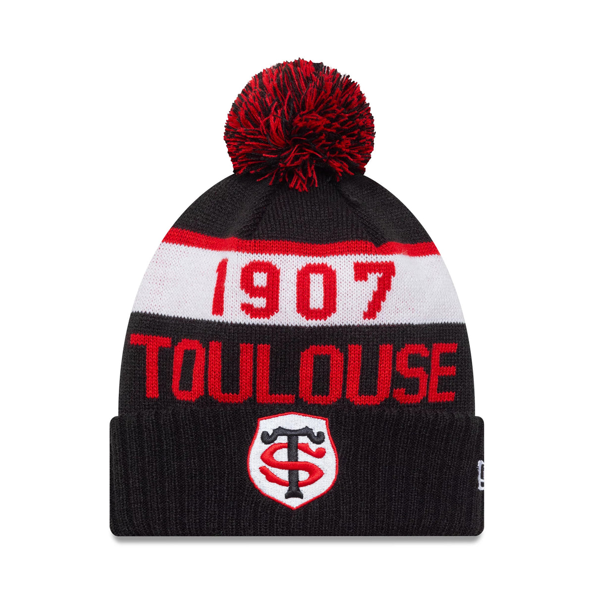 New Era Stade Toulousain Kids Black Sport Knit Beanie Hat, front view showing Toulouse and 1907 in red and white, with a red and black pom-pom on top and the embroidered ST crest centred on the cuff.