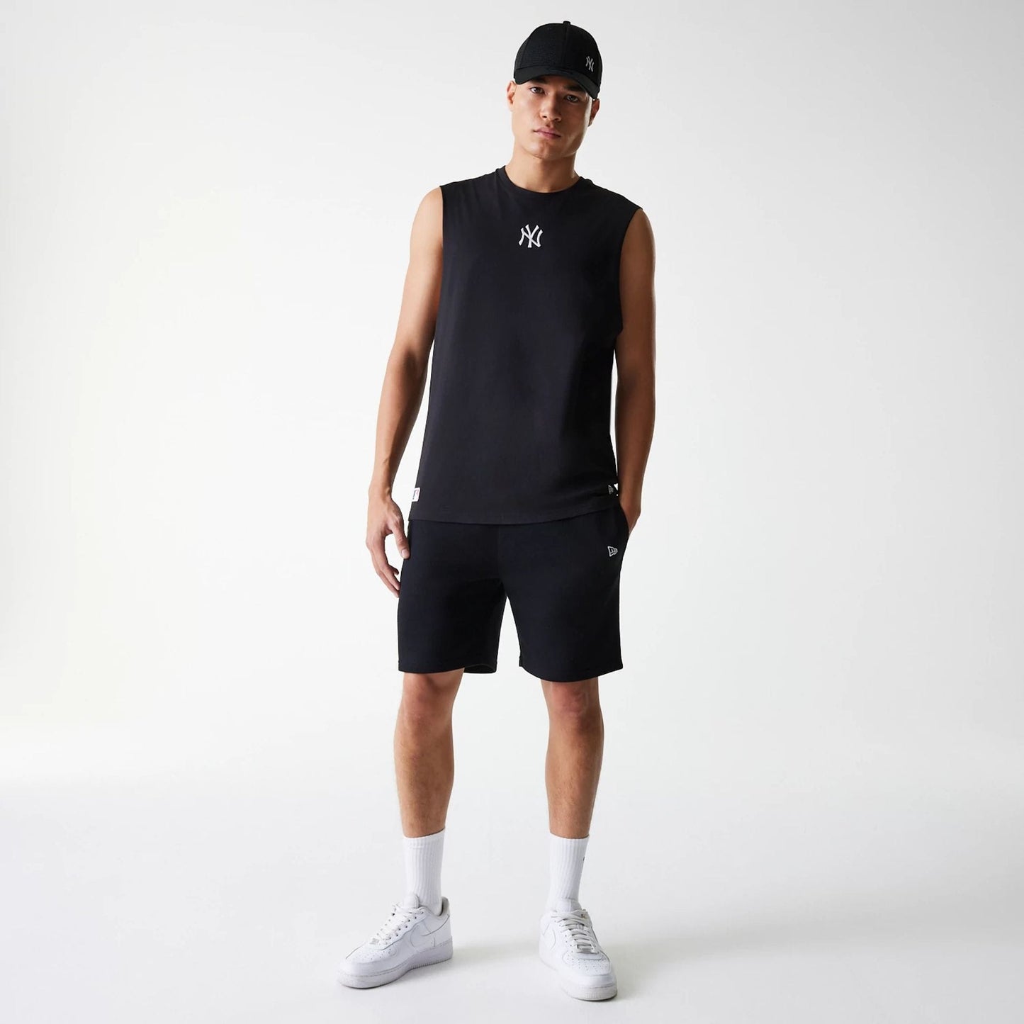 The Male model is wearing New York Yankees MLB Midi Black Sleeveless T-Shirt 6