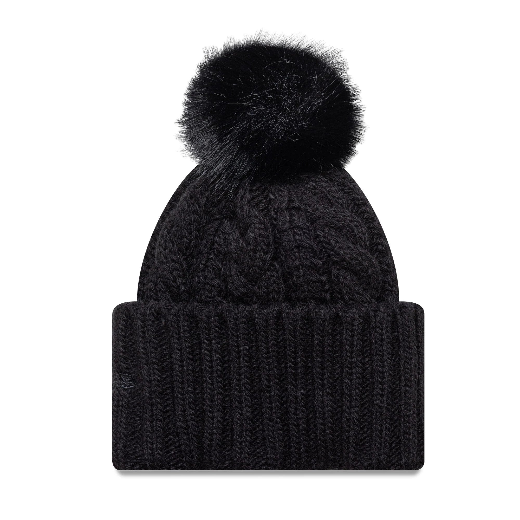 New Era New York Yankees Youth MLB Black Cable Knit Beanie Hat, front view showing a thick ribbed fold-over cuff and a fluffy black pom-pom on top centre of the cable knit structure.