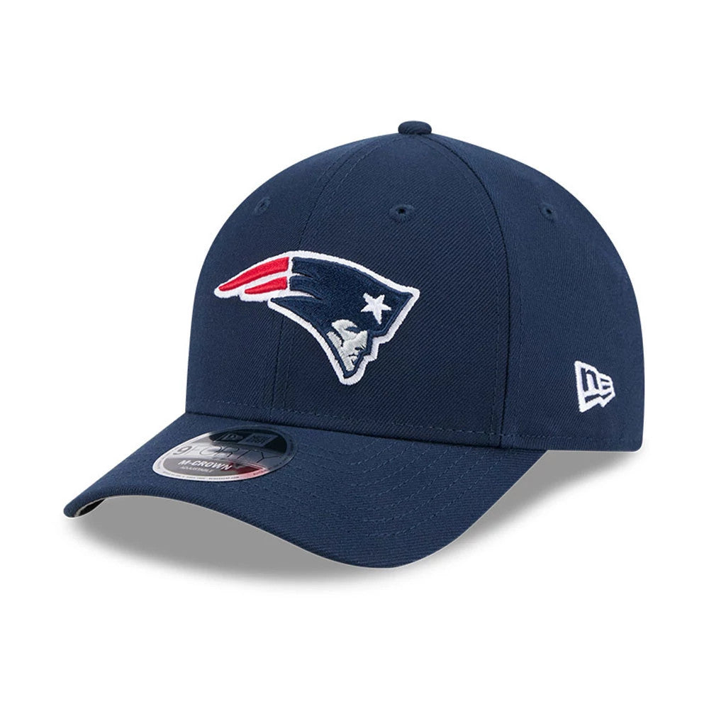 New England Patriots NFL Team Dark Blue New Era 9FORTY M-Crown Cap, three-quarter view showing the raised embroidered Patriots logo on the front panel, bent visor with a 9FORTY size sticker, and the New Era flag logo on the left side.