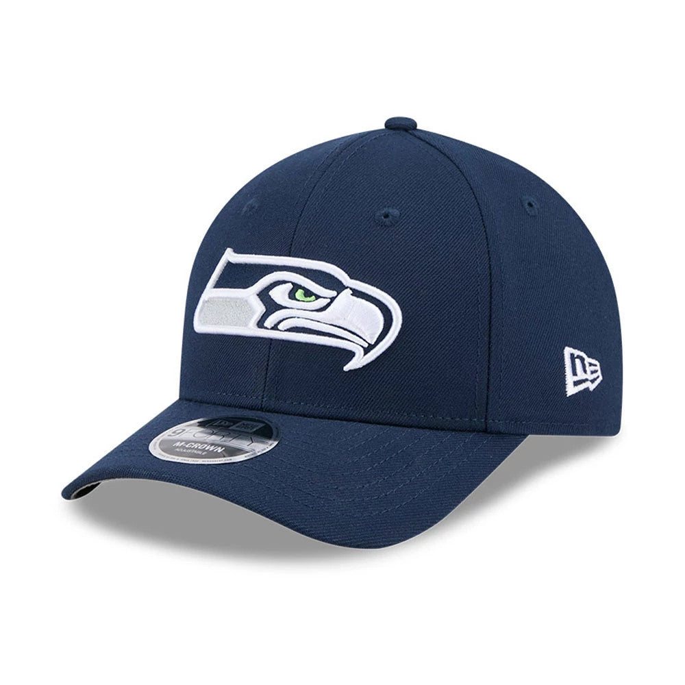 Seattle Seahawks NFL Team Dark Blue New Era 9FORTY M-Crown Cap, three-quarter view showing raised white and green Seahawks logo on front panel, curved visor with 9FORTY size sticker, and New Era flag logo on the left side.