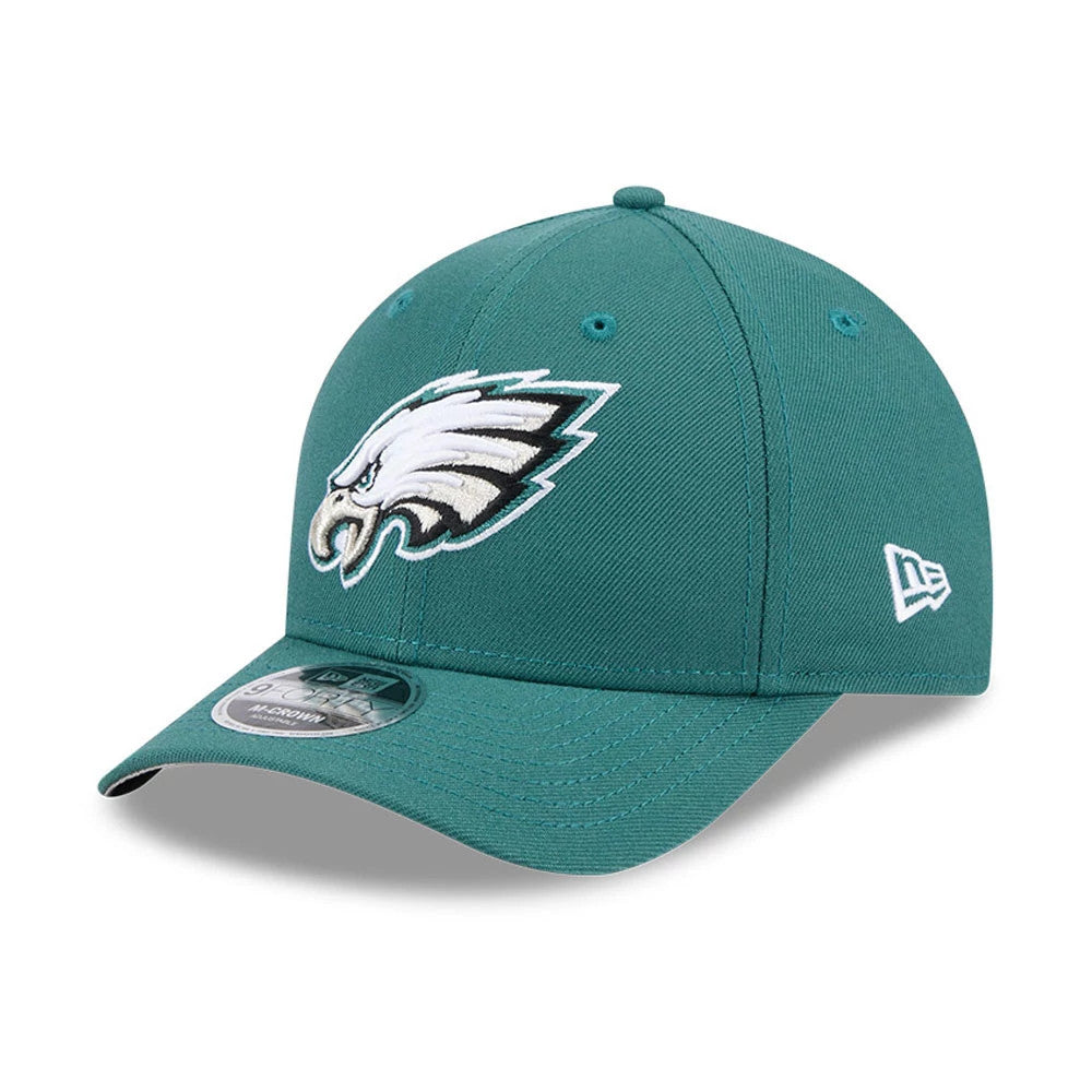 Philadelphia Eagles NFL Team Dark Green New Era 9FORTY M-Crown Cap, three-quarter view showing the raised embroidered Eagles logo on the front panel, curved visor with 9FORTY size sticker, and New Era flag logo on the left side.