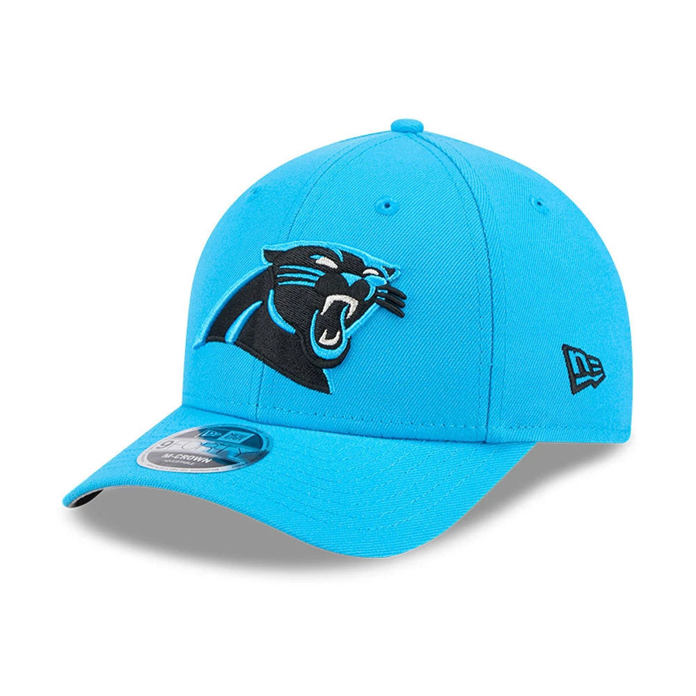 Carolina Panthers NFL Team Blue New Era 9FORTY M-Crown Cap, three-quarter view showing the embroidered black panther logo on the front panel, matching blue visor with 9FORTY size sticker, and New Era flag logo on the left side.