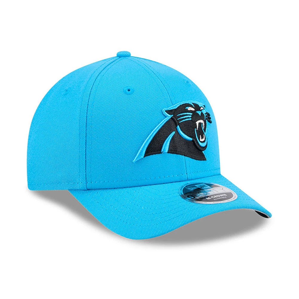 Carolina Panthers NFL Team Blue New Era 9FORTY M-Crown Cap, front view showing the embroidered black and blue Panther logo on the front panel, with a curved visor featuring a 9FORTY size sticker, and matching blue eyelets and top button.