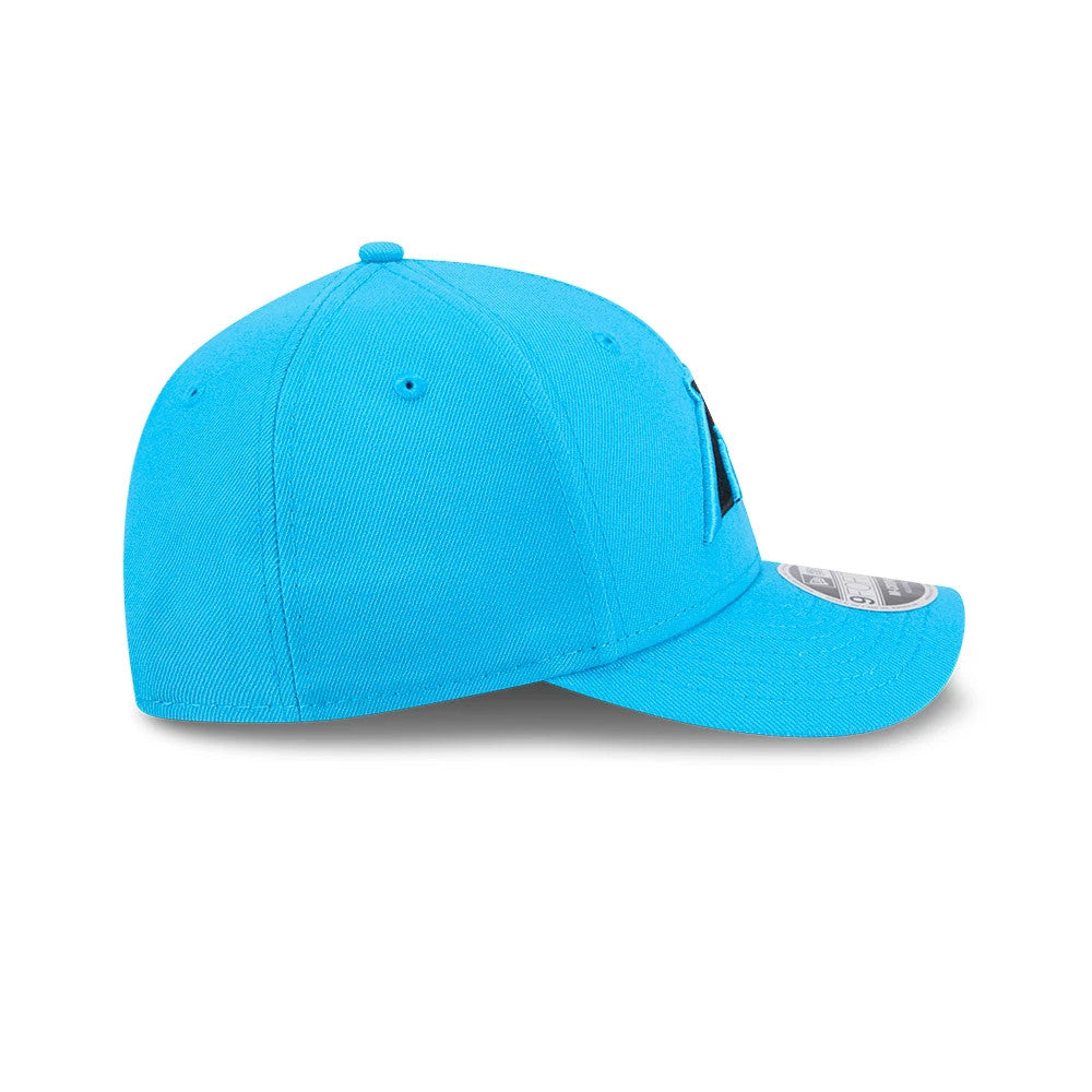 Carolina Panthers NFL Team Blue New Era 9FORTY M-Crown Cap, side view showing a curved visor with a 9FORTY size sticker and black embroidery on the front panel, centred seam and structured crown.