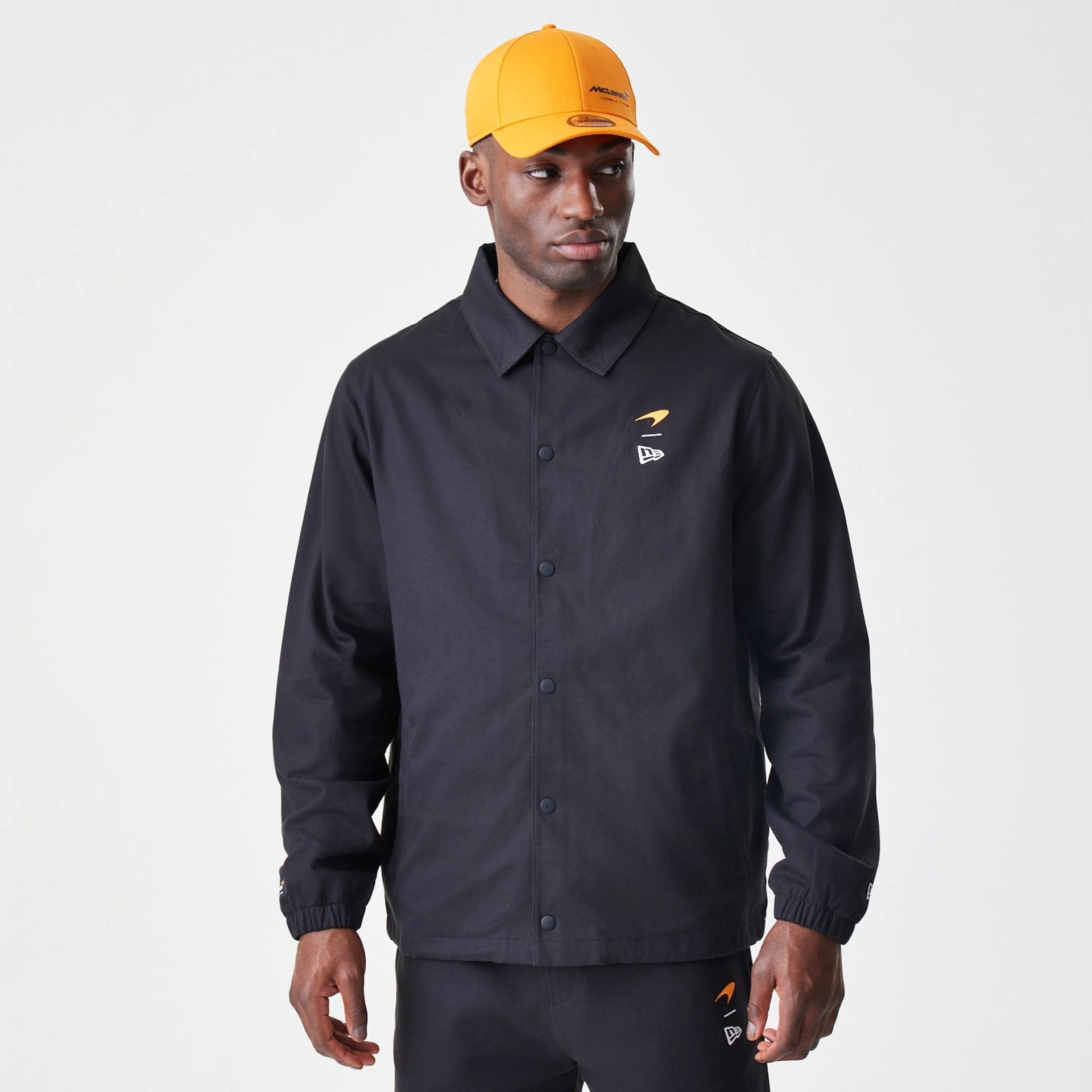 The Male model is wearing McLaren Racing McLaren Black Coaches Jacket 1