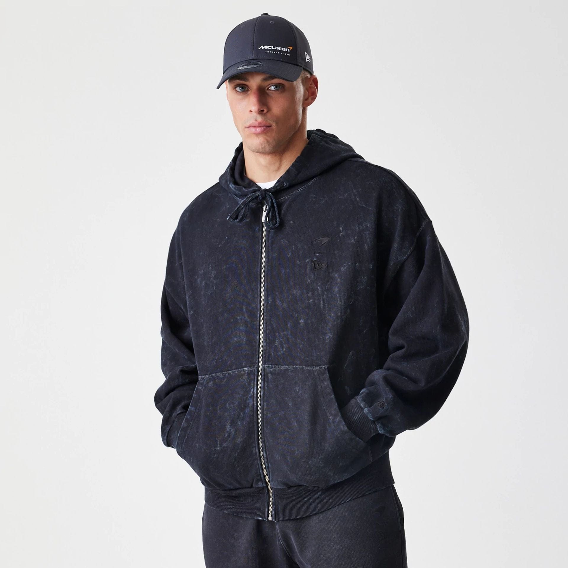 The Male model is wearing McLaren Racing Washed Black Oversized Full Zip Hoodie 1