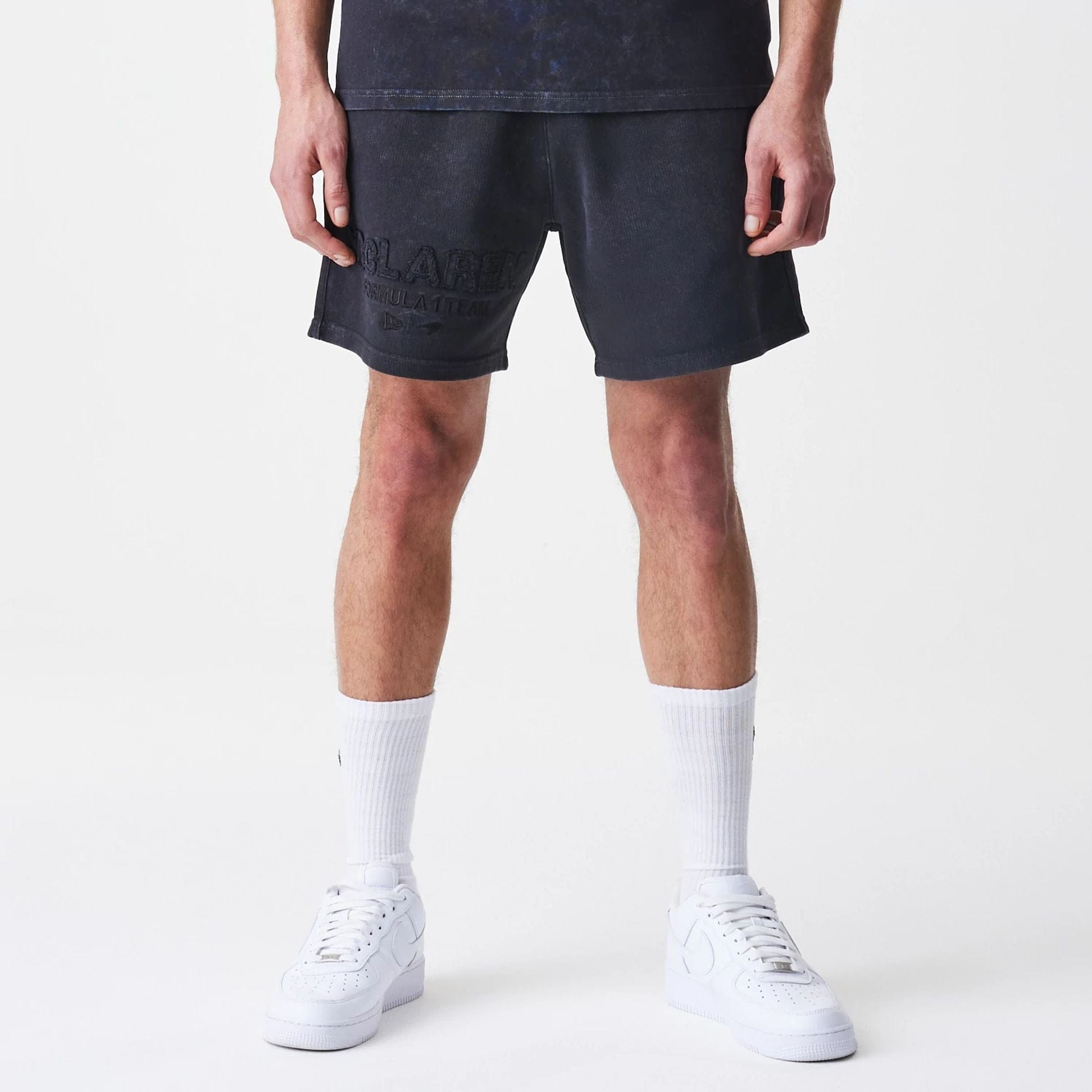The Male model is wearing McLaren Racing Washed Black Shorts 1